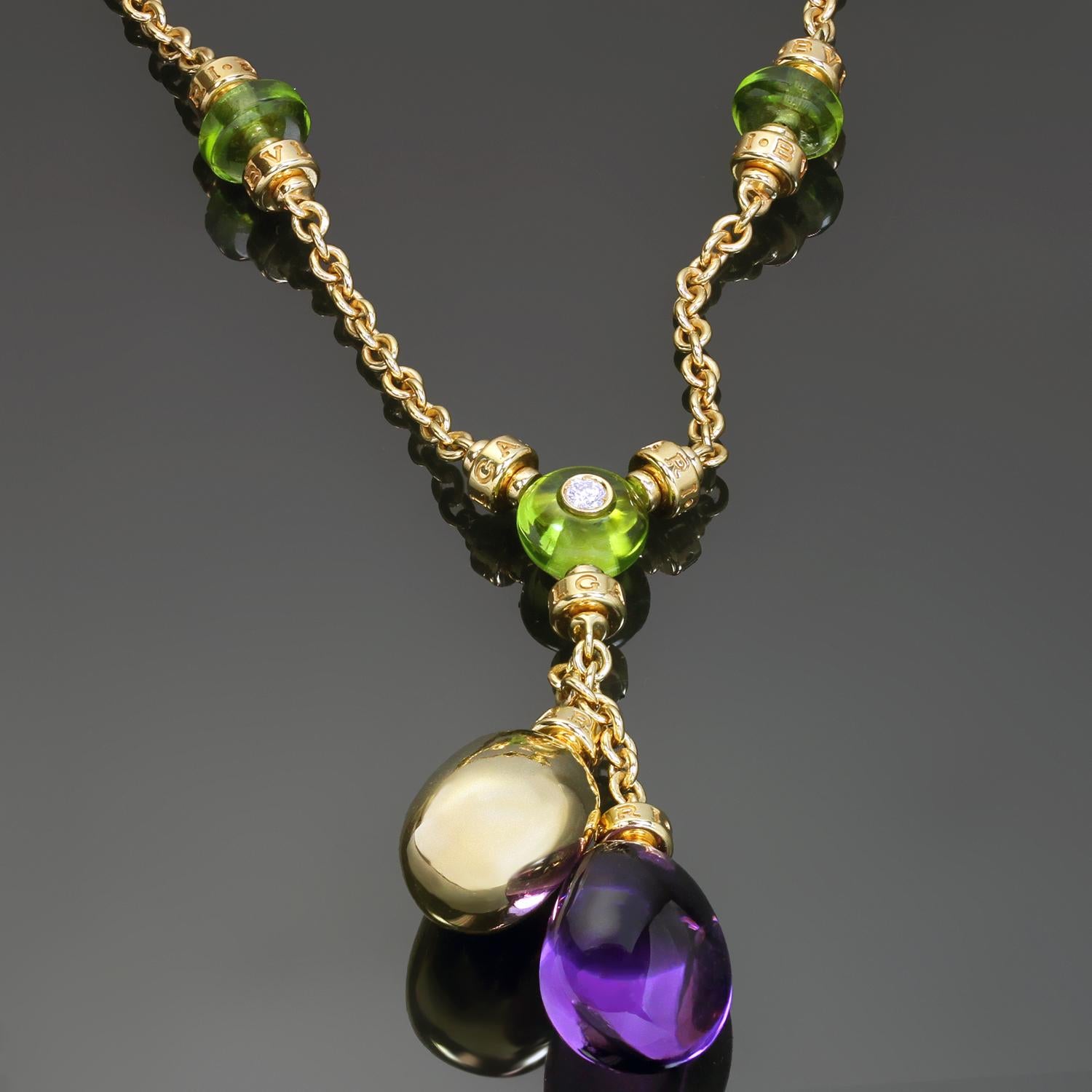 This gorgeous Bulgari necklace from the vibrant Mediterranean Eden collection is crafted in 18k yellow gold and features a pendant centered with a cabochon peridot and a brilliant-cut round E-F VVS1-VVS2 diamond weighing an estimated 0.10 carats,