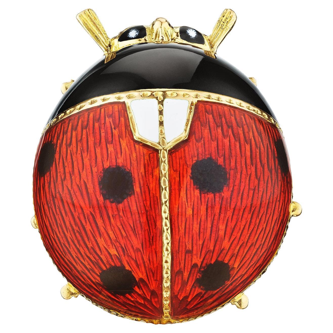 Ladybugs are known to bring good luck, and this modernist Bulgari enameled plump bug brooch is filled with only the best of tidings.  Circa 1980.  Signed Bulgari.  18 karat yellow gold.  1 1/10