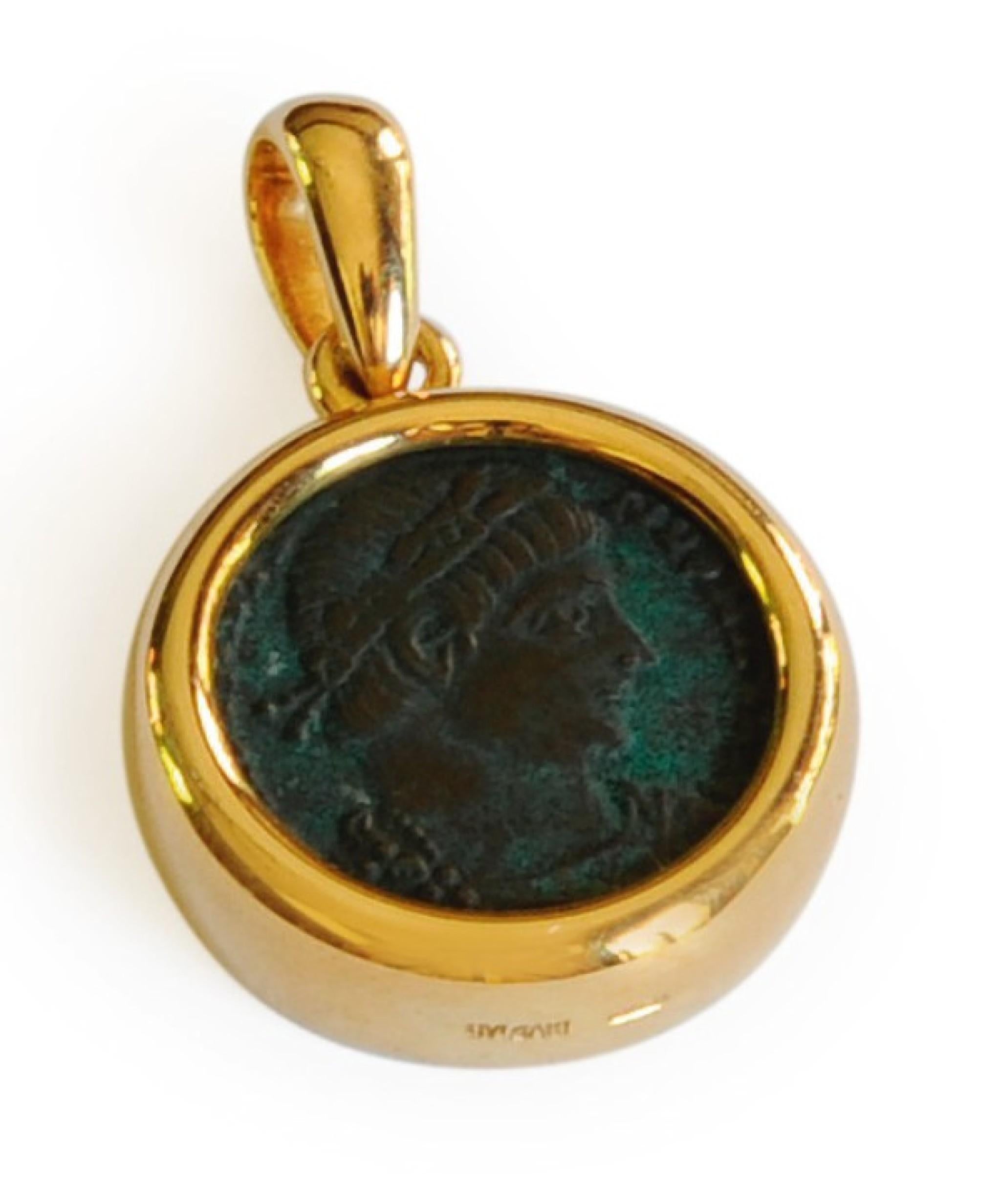 A classic Bulgari Monete piece featuring an ancient bronze Roman coin inscribed ‘Rome Constantinus I Aug. A.D. 307-337’ suspended from a two-color 18 karat gold braided necklace. Internal circumference 14½ inches. Made in Italy.
