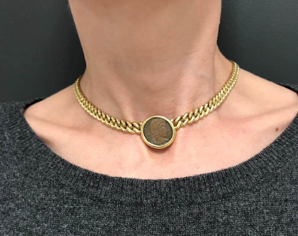 An iconic Bulgari Monete 18k gold necklace, featuring an ancient Roman coin. The coin is depicting emperor Magnentius, AD 350-353. It's bezel set and attached to the curb link chain. The Monete collection is one of the hottest at the moment among