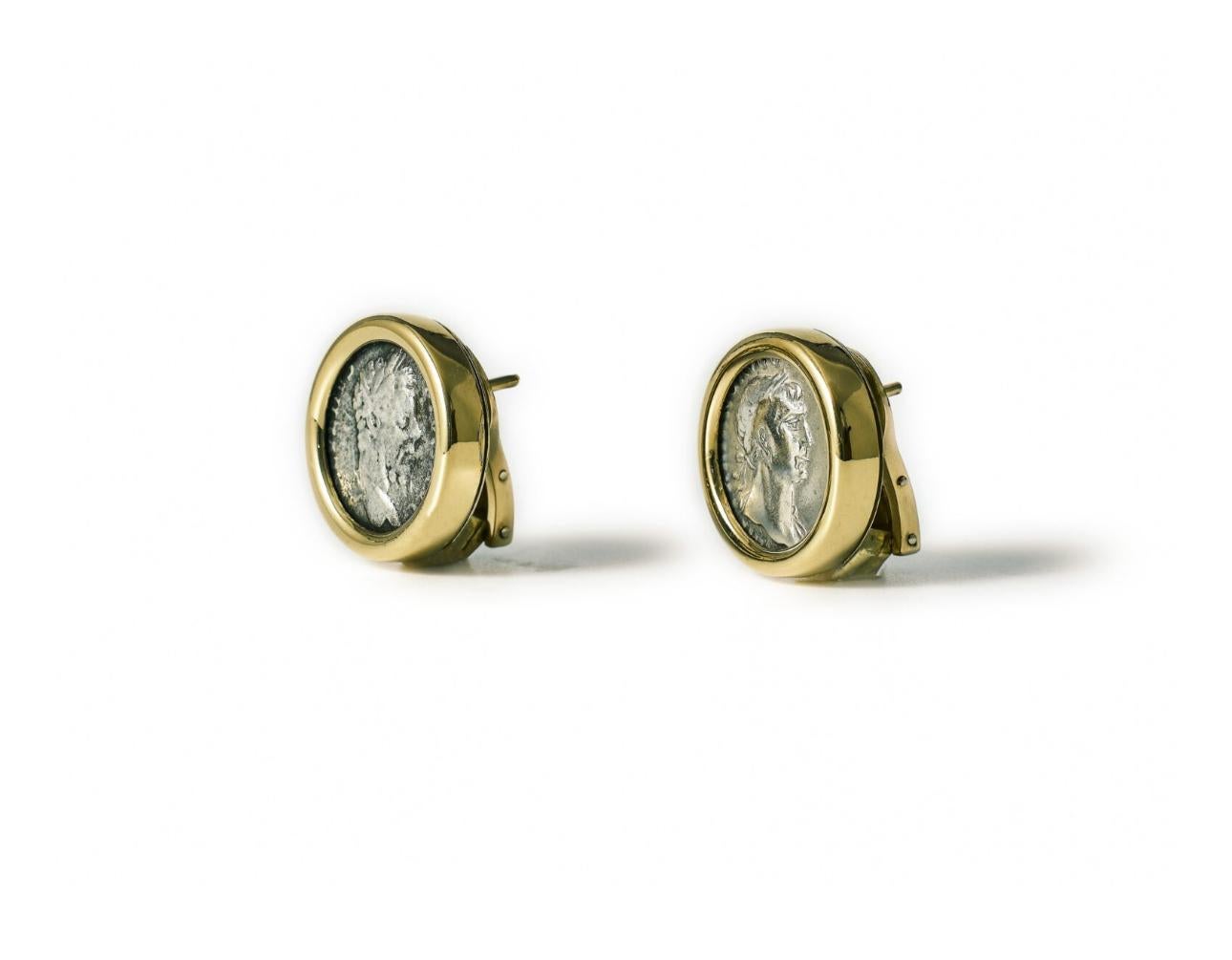 Beautiful 18k yellow gold earrings, crafted by Bulgari for Monete collection, one of the most popular and valuable collection of the famous brand present also in their museum in Rome.

They're set with rare ancient silver coins: Traiano denario 98