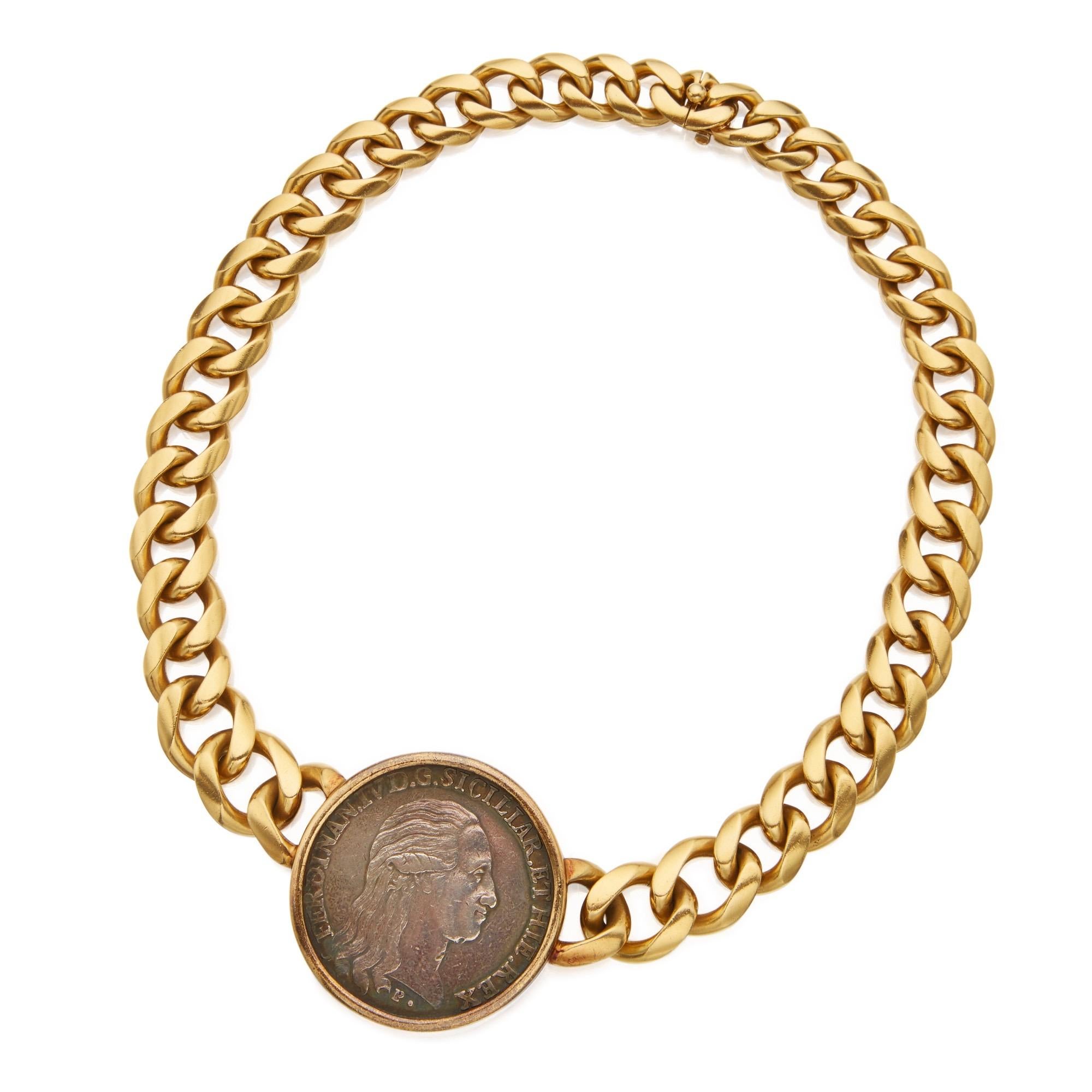 A Bulgari Monete 18 karat yellow gold curb link chain necklace featuring a large silver coin dated 1790, depicting Ferdinand IV/III, the King of Naples and Sicily, on the front. The reverse depicts the royal Coat of Arms during the King’s reign from