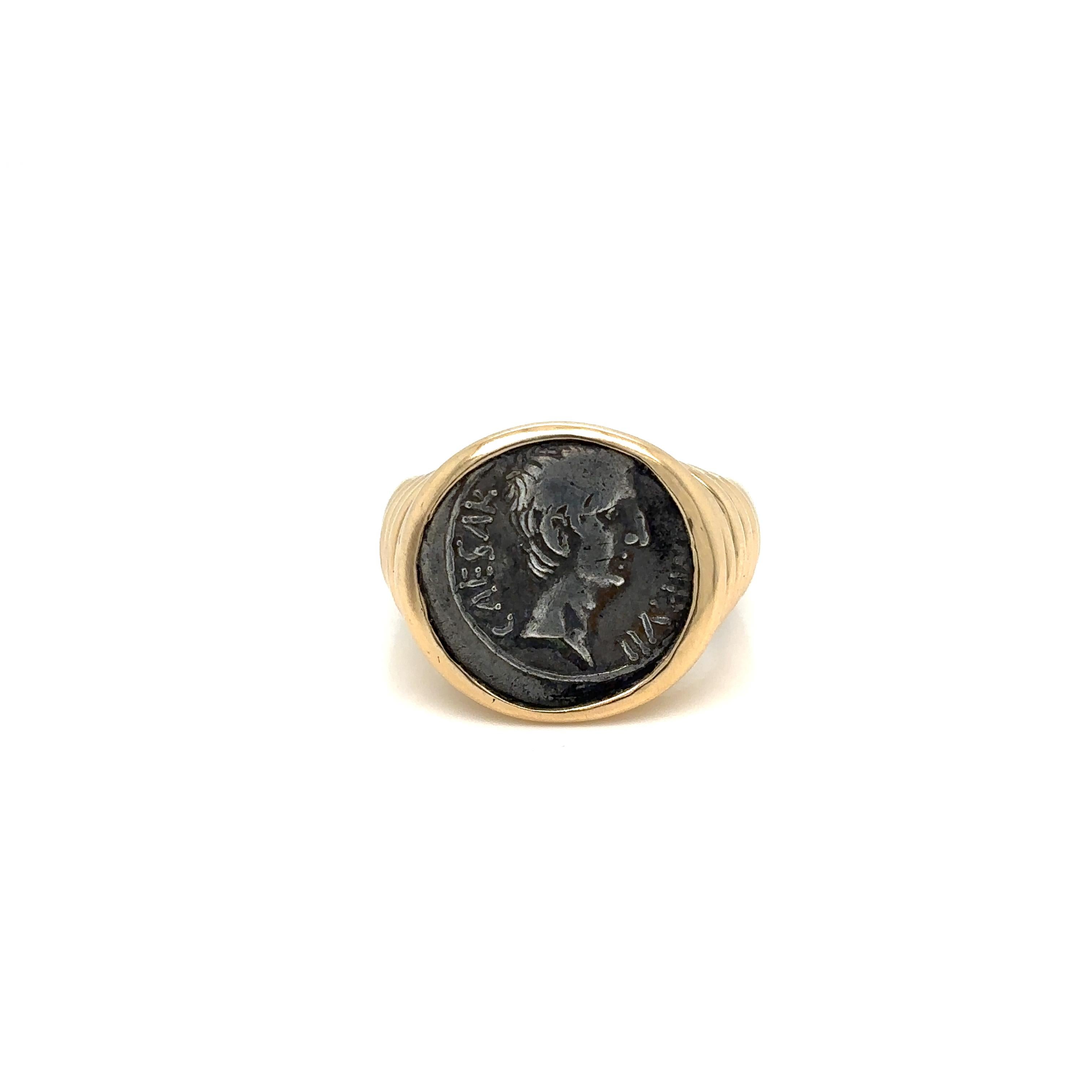 Bulgari 18k gold ring from Monete collection, featuring ancient Augustus Quinarius silver coin. Showing Cesare just how alluring a 2.000-year-old coin can look when combined with a bold, contemporary setting, today the Monete ring captures the