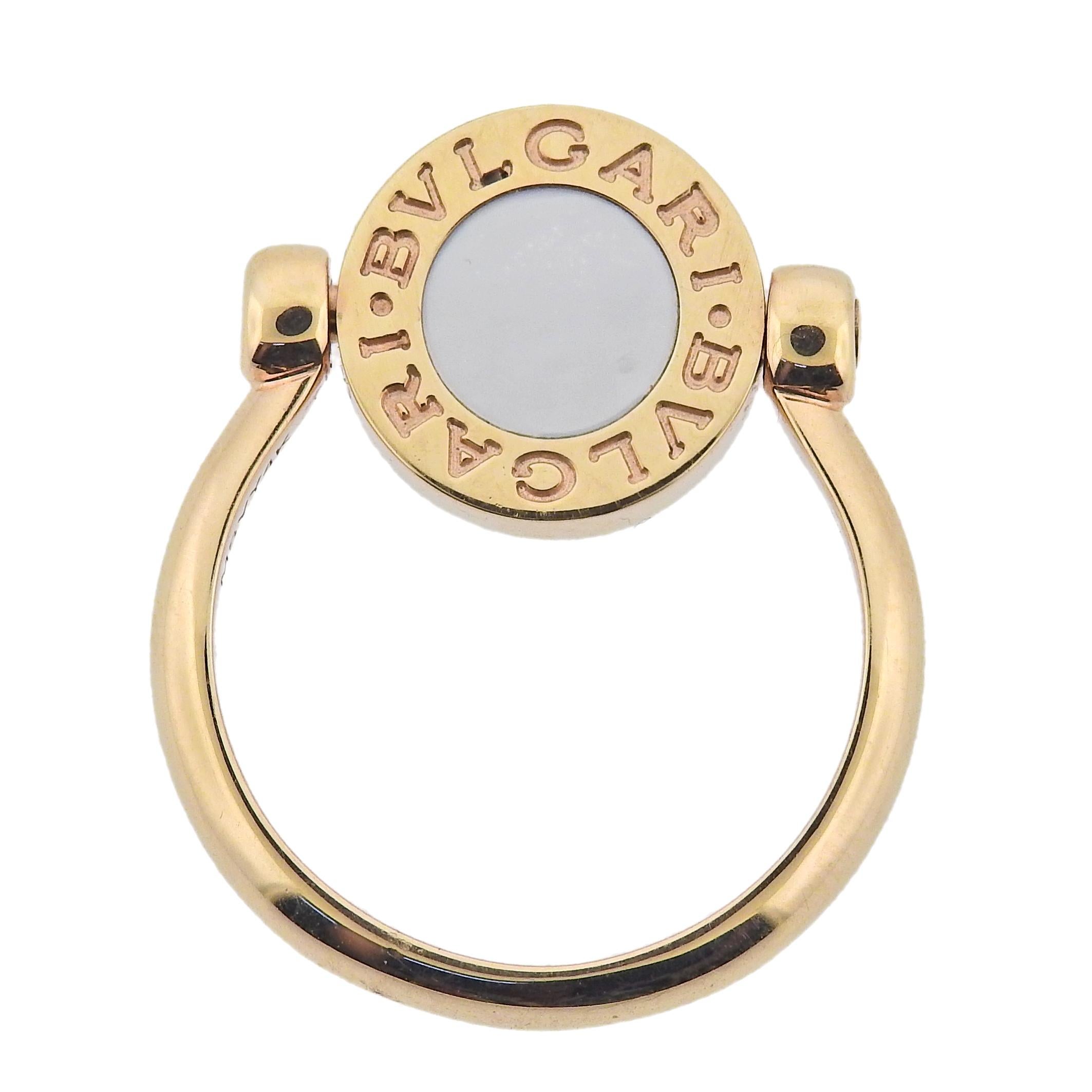 18k rose gold Bvlgari flip top ring, with carnelian and mother of pearl. Retail $2640. Comes with COA and box. Ring top is 12mm in diameter. Marked Bvlgari, made in Italy, Italian mark, 750, Serial number. Weight 5.5 grams. Available in sizes 49,