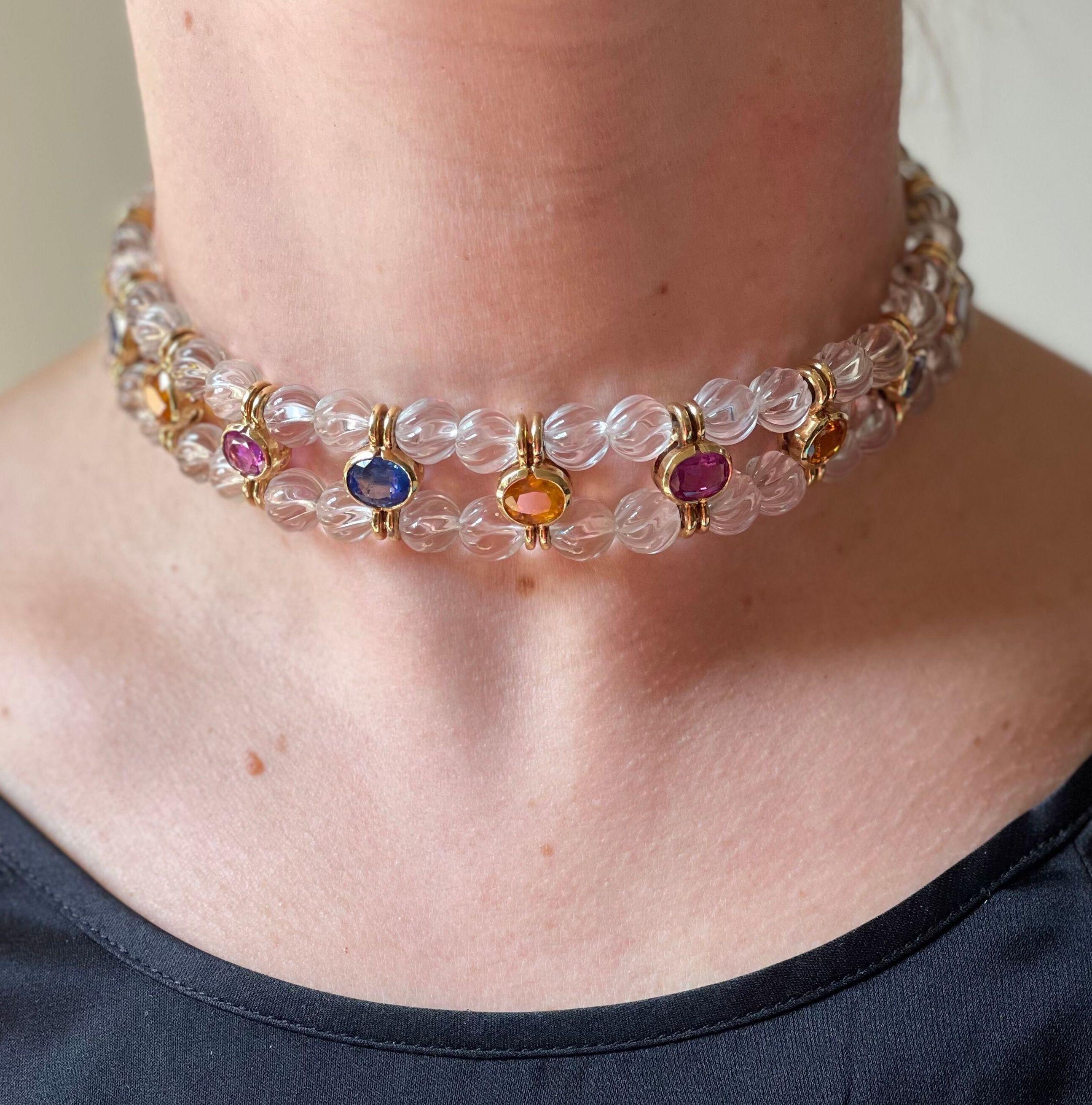 Vintage Bvlgari choker necklace in 18k gold, with carved crystal beads and multi color vibrant sapphires. Necklace is 15