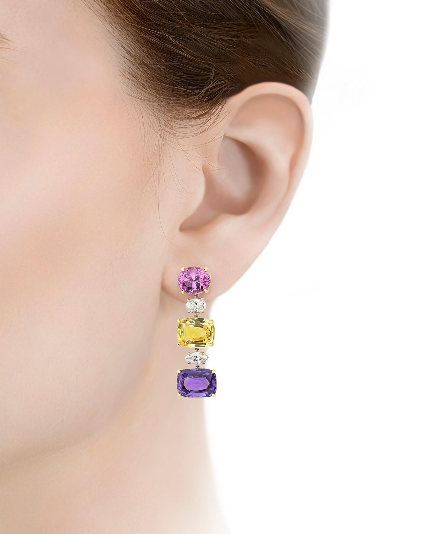 Six stunning sapphires present a sparkling rainbow of hues in these eye-catching earrings by legendary Italian jeweler Bulgari. The dazzling pair showcases 30.24 total carats of sapphires that exhibit a delightful array of hues, from traditional