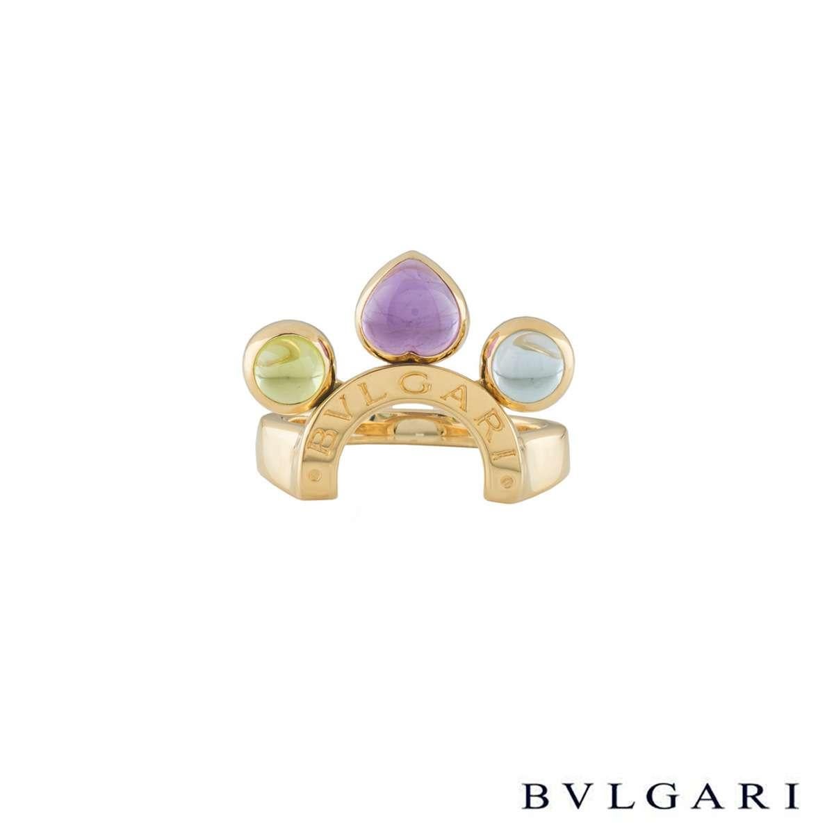 A stunning pair 18k yellow gold multi gem Bvlgari ring from the Allegra collection. The ring are composed of an open work C motif design and engraved with the iconic Bvlgari logo through the centre. Suspended from the motif are 3 cabochon cut