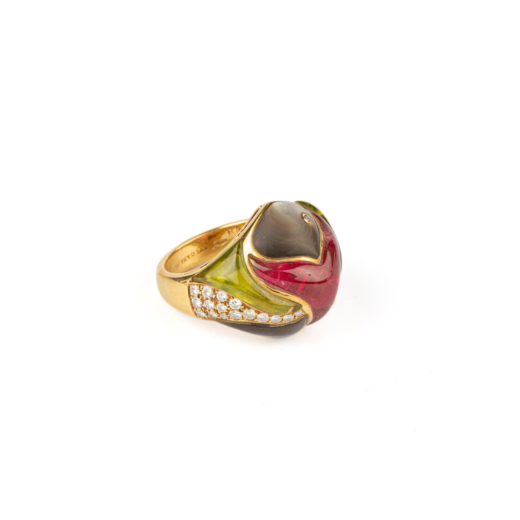 Bulgari rare 18 karat gold, tourmaline, peridot, mother of pearl and pave diamond ring from the Naturalia collection in a stylized fish shape with diamond eye accents. Made in Italy, circa 1980. 