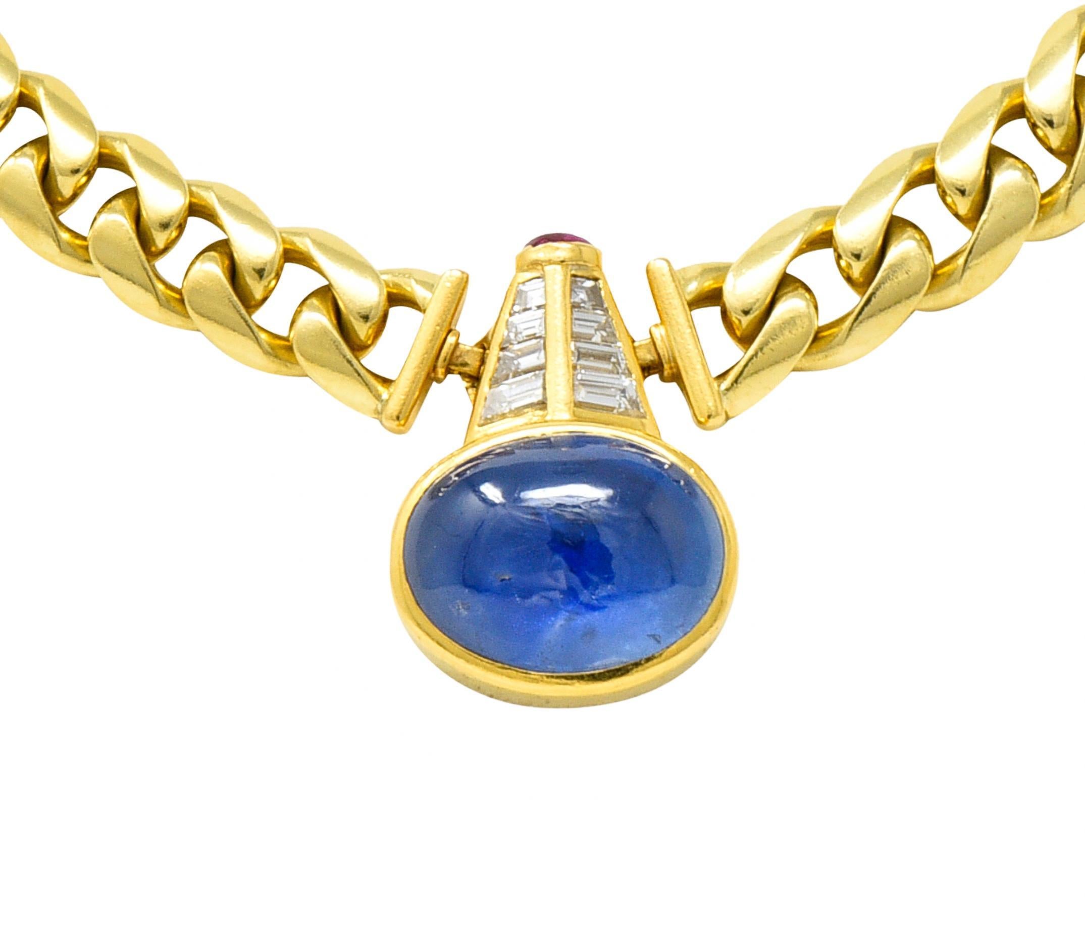 Designed as a curb chain with a central station featuring an oval shaped sapphire cabochon
Natural Burmese in origin with no indications of heat treatment 
Weighing approximately 17.16 carats total - bezel set East to West
Transparent blue in