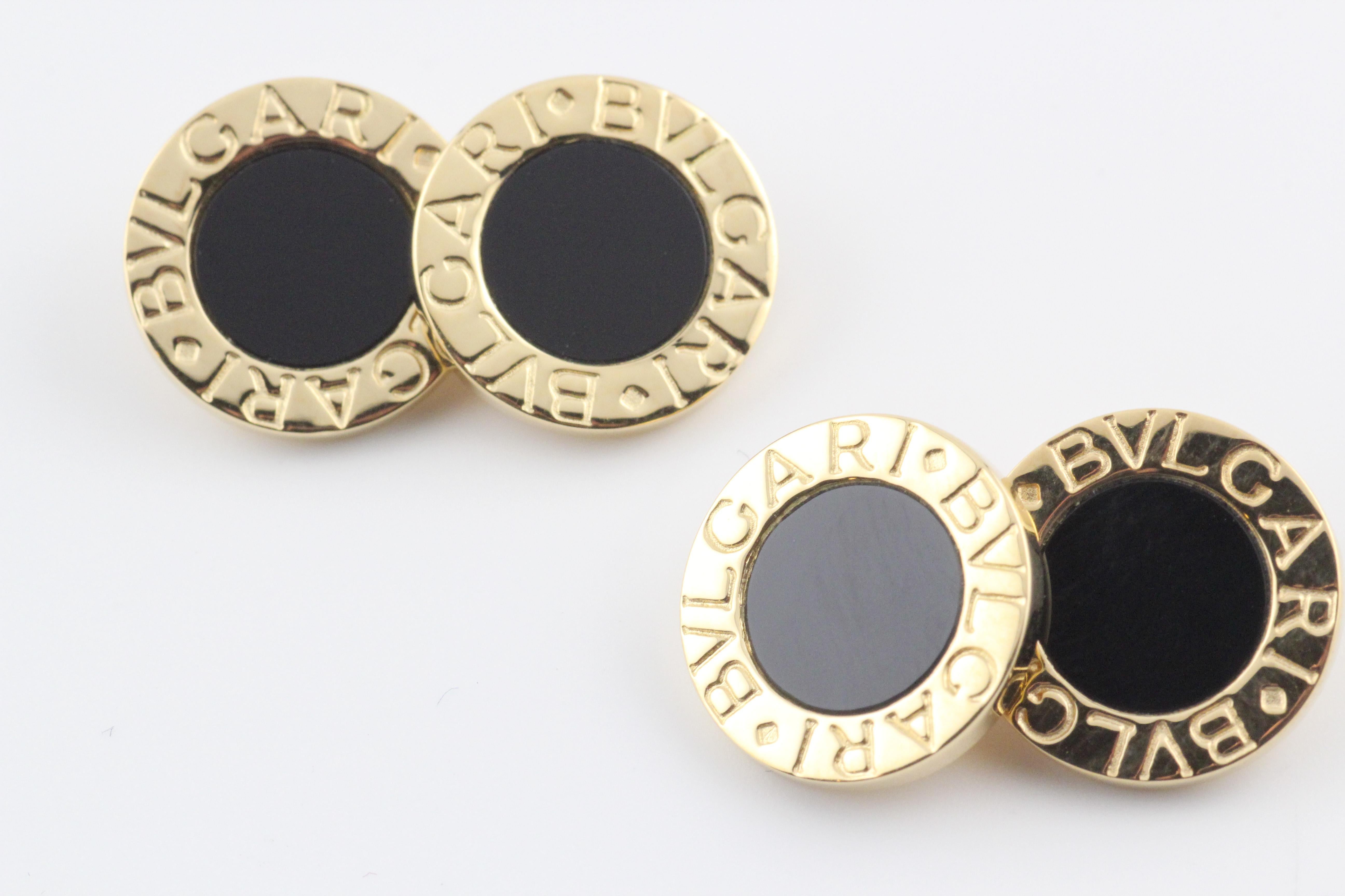 The Bulgari Bulgari Onyx 18k Gold Cufflinks and 4 Studs Set is a testament to the brand's commitment to luxury, sophistication, and timeless design. Bulgari, known for its exceptional craftsmanship and distinctive aesthetic, brings a touch of