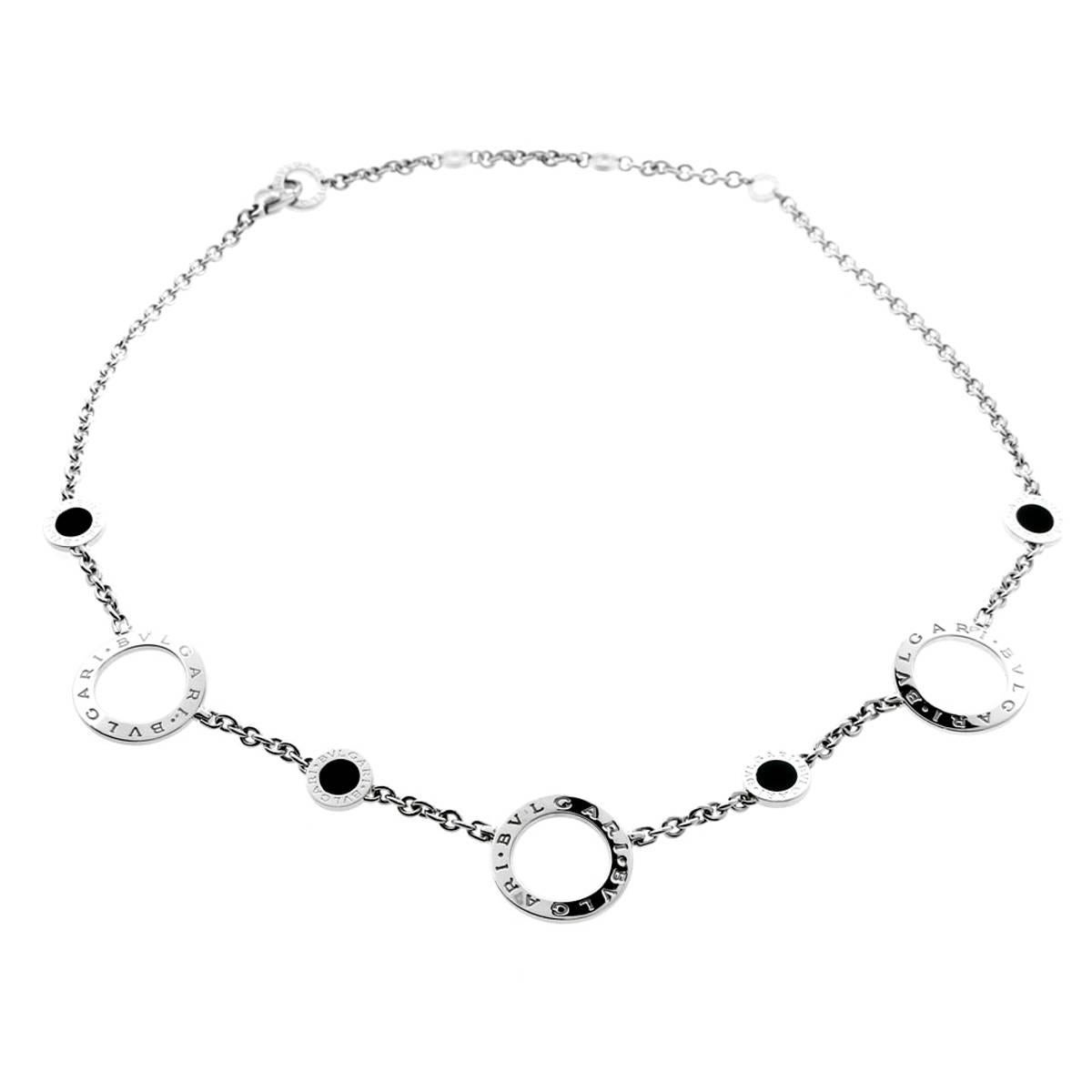 A fine Bulgari keepsake, this polished 18K white gold necklace is a wear-anywhere piece of jewelry. Alternating black onyx semi-precious spacer stones and polished Bulgari imprinted circles display the intricate yet contemporary luxury style of the