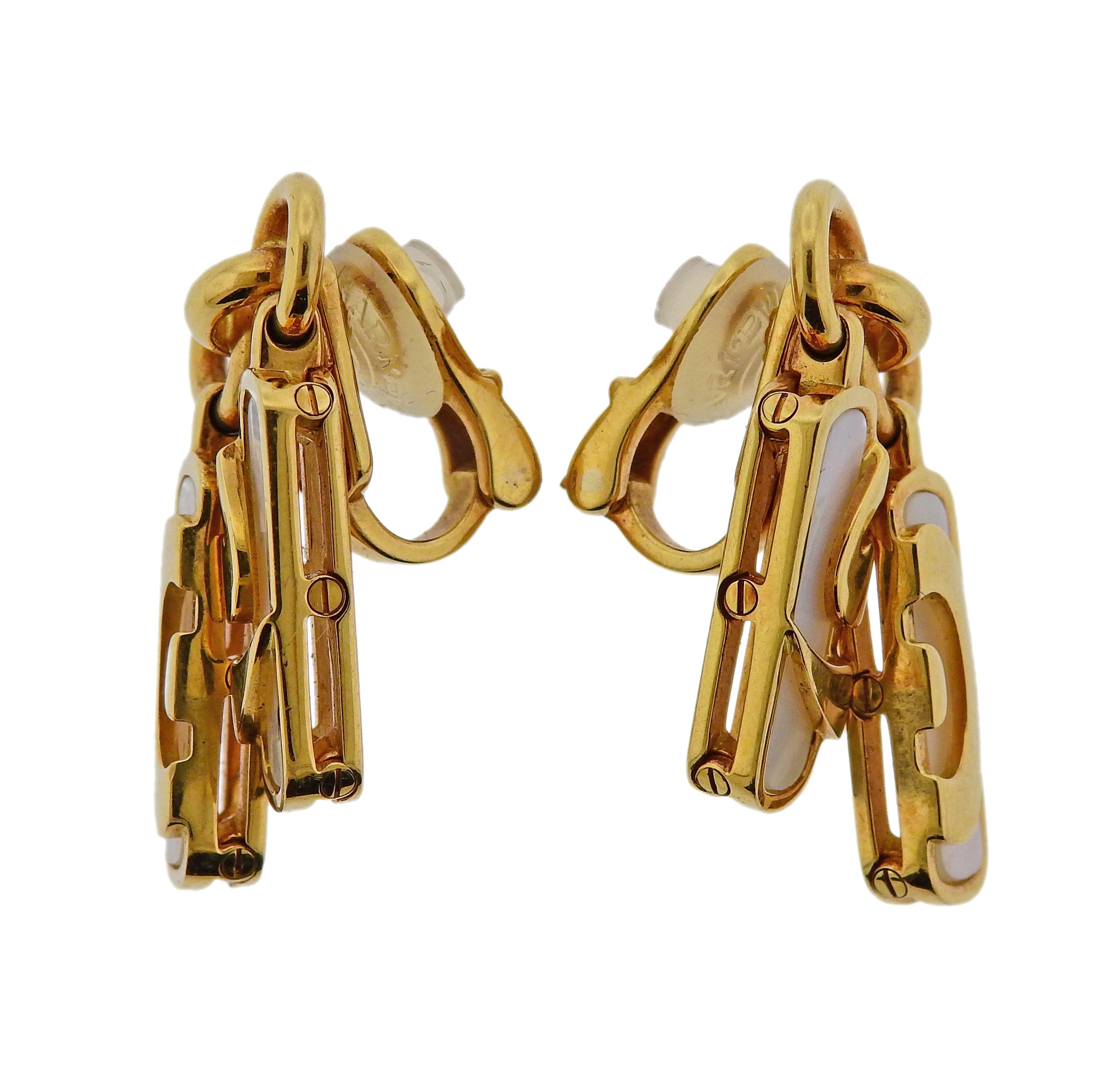Pair of 18k gold Bulgari earrings from Optical Illusion collection, set with mother of pearl. Measure 31mm x 16mm. Marked Bvlgari, made in Italy, 750. Weigh 21.6 grams.

SKU#E-02718