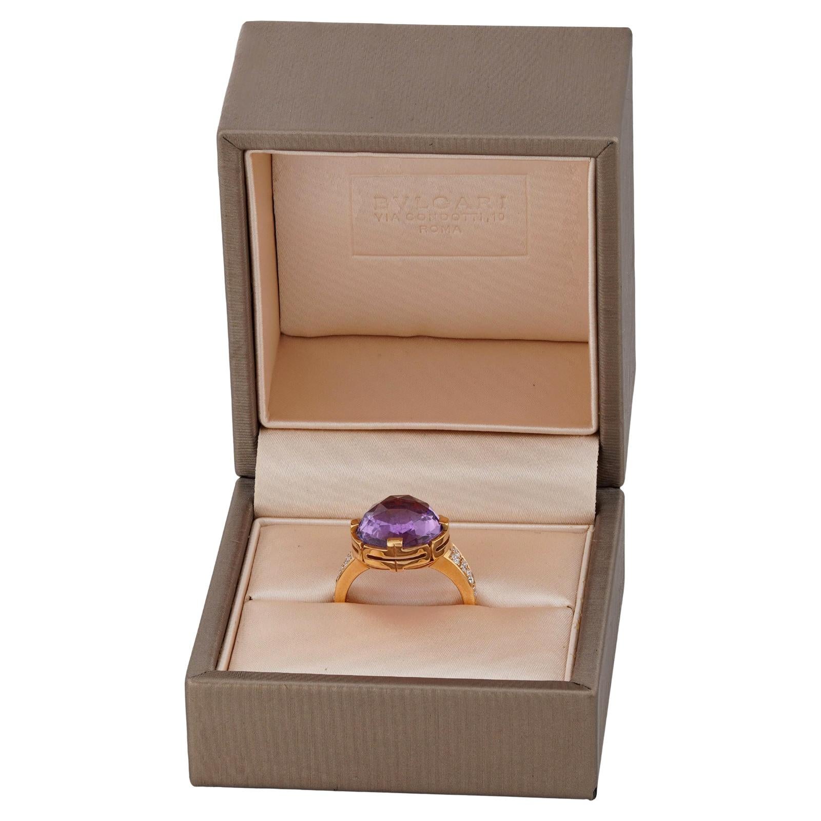 This timeless cocktail ring from Bulgari's striking Parentesi collection is crafted in 18k rose gold and set with a faceted purple amethyst stone and pave brilliant-cut VVS2-VS1 diamonds weighing an estimated 0.32 carats. Made in Italy circa 2018.
