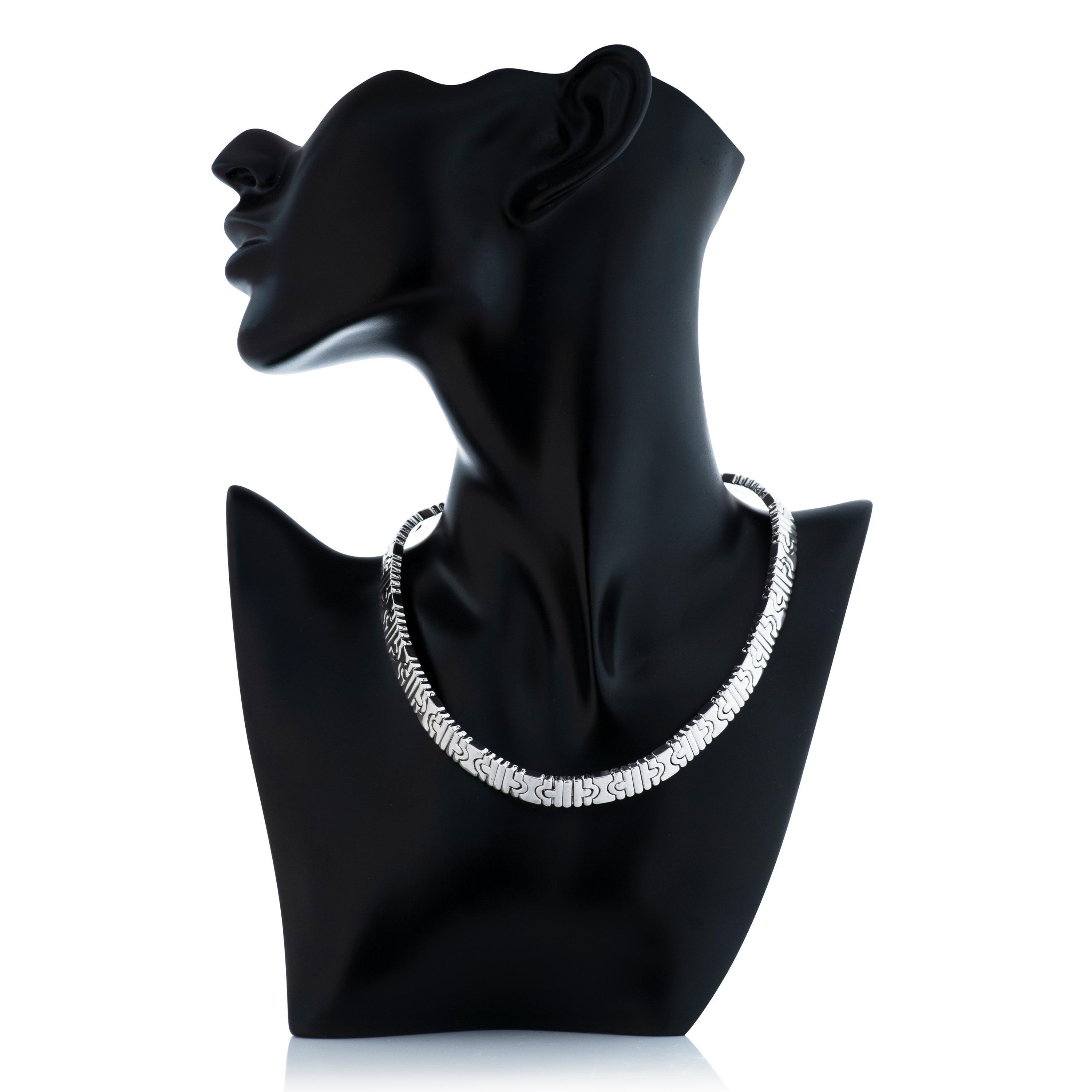 Bulgari Parentesi collection collar/choker necklace in 18k white gold.  

This necklace is 3/8