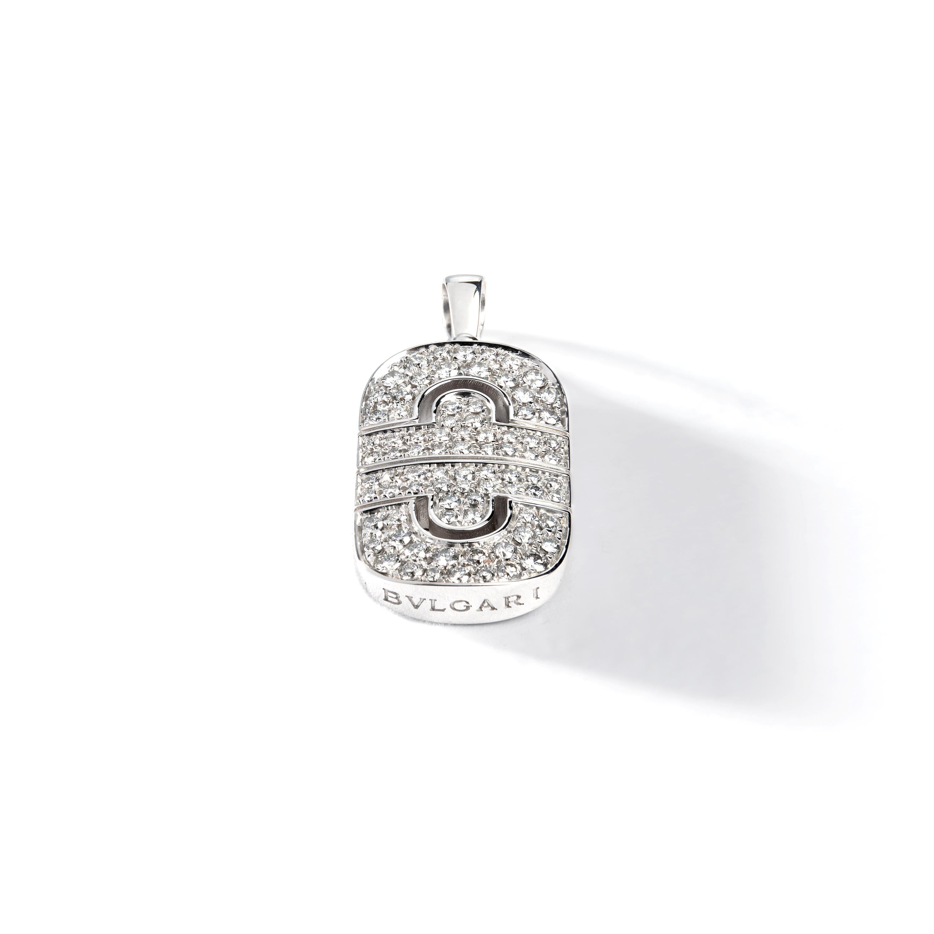 Crafted in 18K white gold. Polished as new.
Set with round brilliant-cut diamonds weighing a total of approximately 0.84 carat, most with G-H color and VS clarity.

Dimensions: 1.38 inch x 0.59 inch.
3.50 x 1.50 centimeters. 

Matching earrings