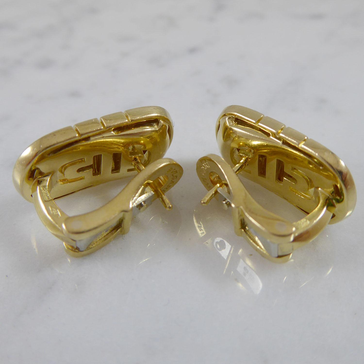 Vintage gold earrings from Bulgari crafted in 18ct yellow gold.  In the iconic Parentesi design, the earringes are a rectangular shape with D shaped ends.  With a post for pierced ear fitting and a hinged clip catch which is stamped 