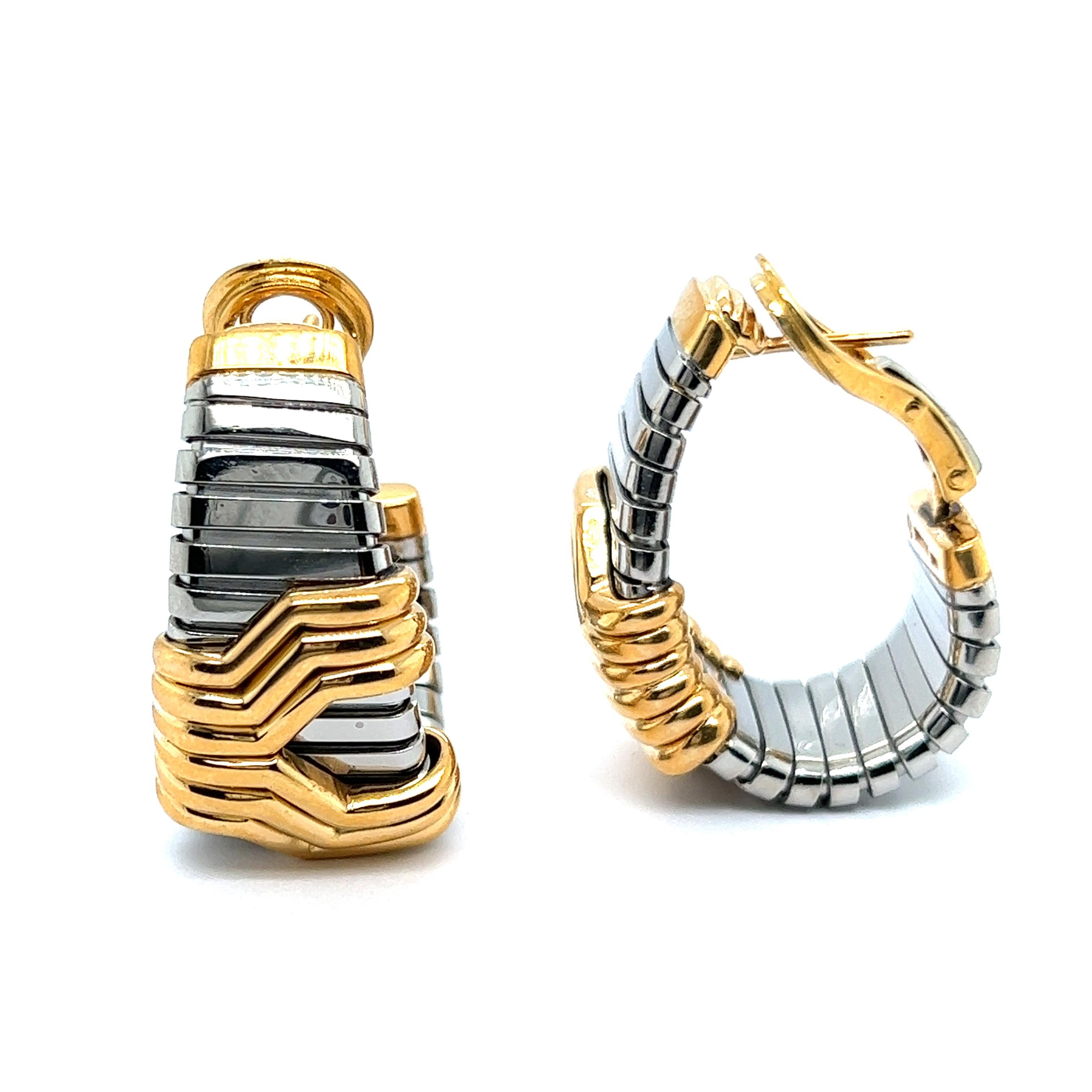 A fine pair of Bvlgari hoop earrings in a 'Parentesi' pattern, inspired by the eternal city of Rome. 
Crafted from 18K gold and stainless steel, collection is an embodiment for modern сhic and elegance. 

This iconic piece was manufactured in Italy