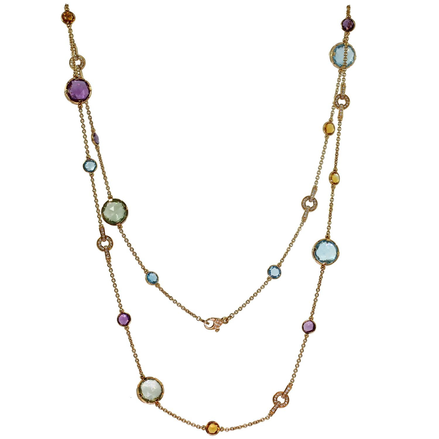 This rare and gorgeous long cocktail necklace from Bvlgari's vibrant Parentesi collection is crafted in 18k rose gold and set with  the Amethyst Citrine Blue Topaz Diamond Rose Gold  alternating links of round topaz, amethyst and citrine briolettes
