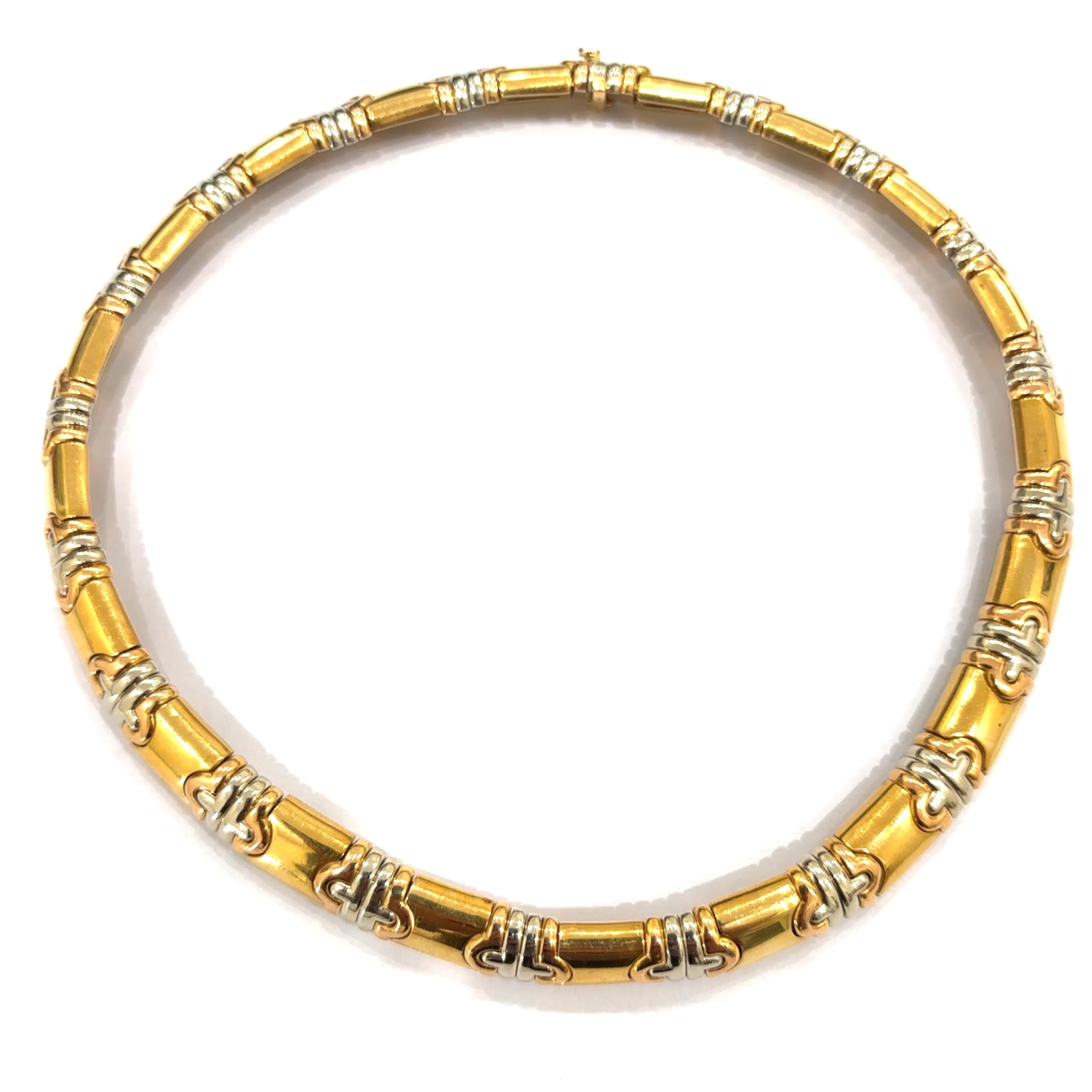 Iconic and rare vintage Bulgari Parentesi 18 carat yellow, rose and white gold necklace is composed of sculpted geometric links. Made in Rome, circa 1980'

Necklace length 15,74 inches (400 mm) x 0,47 (12 mm) wide
Has a total weight of 110