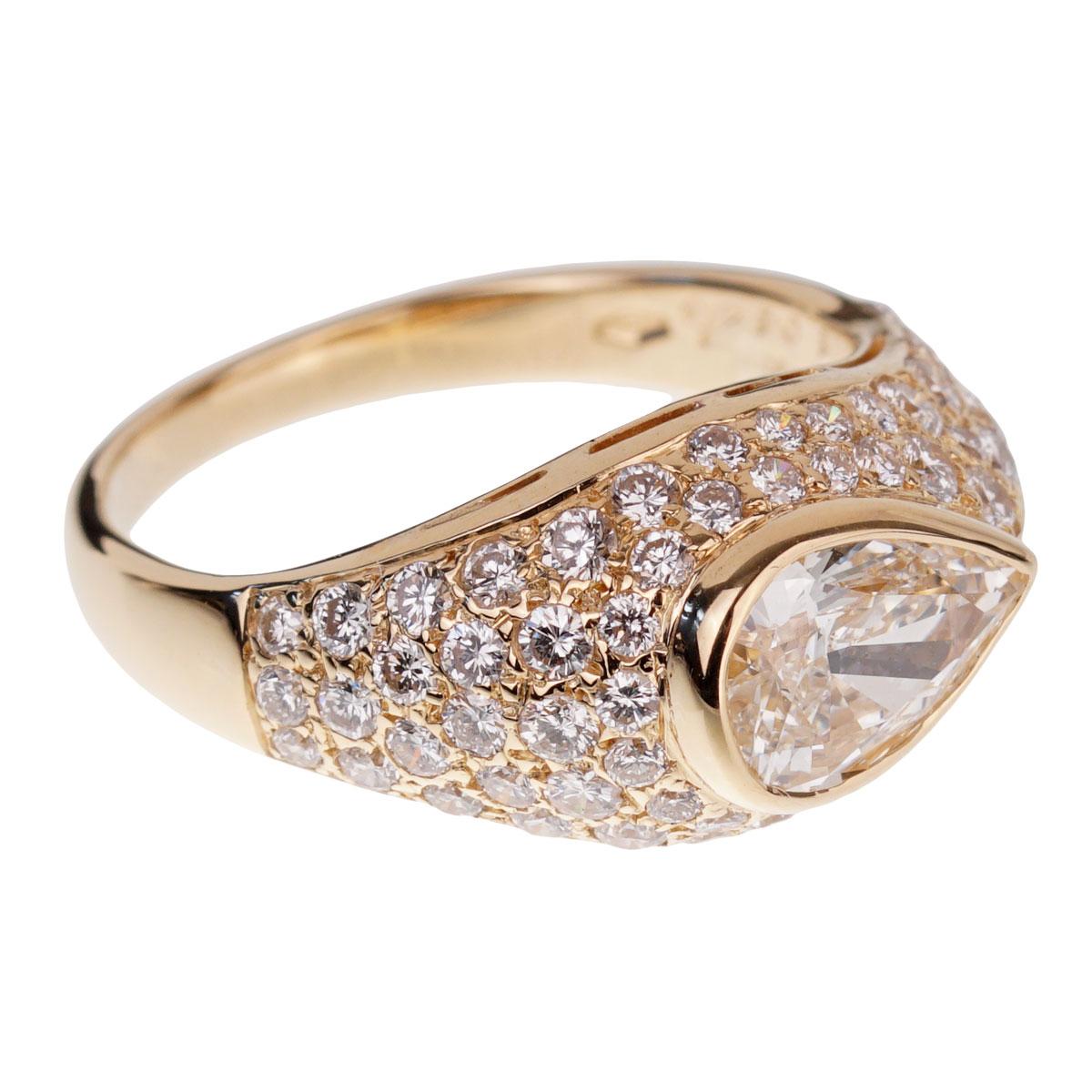 An iconic Bulgari diamond ring showcasing a 1.01ct pear shaped GIA certified diamond surrounded with a plethora of round brilliant cut diamonds in 18k yellow gold.

Size 5 1/2 resizable 