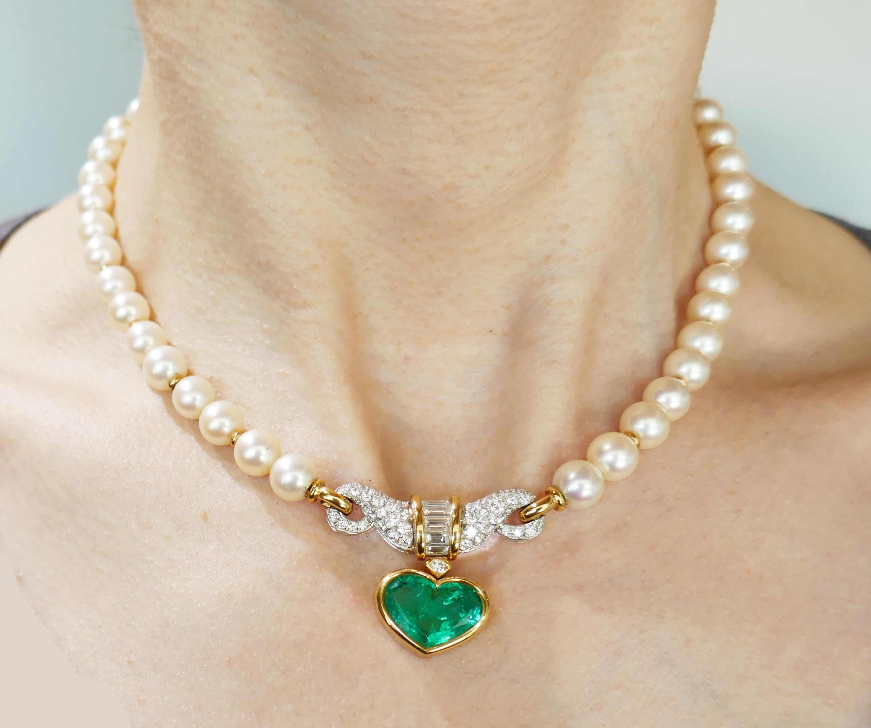 Elegant and timeless necklace created by Bulgari in Italy in the 1980s. Features forty five Akoya pearls, a heart shape faceted emerald set in 18k yellow gold and accented with round brilliant and baguette cut diamonds.
Beautiful classy and