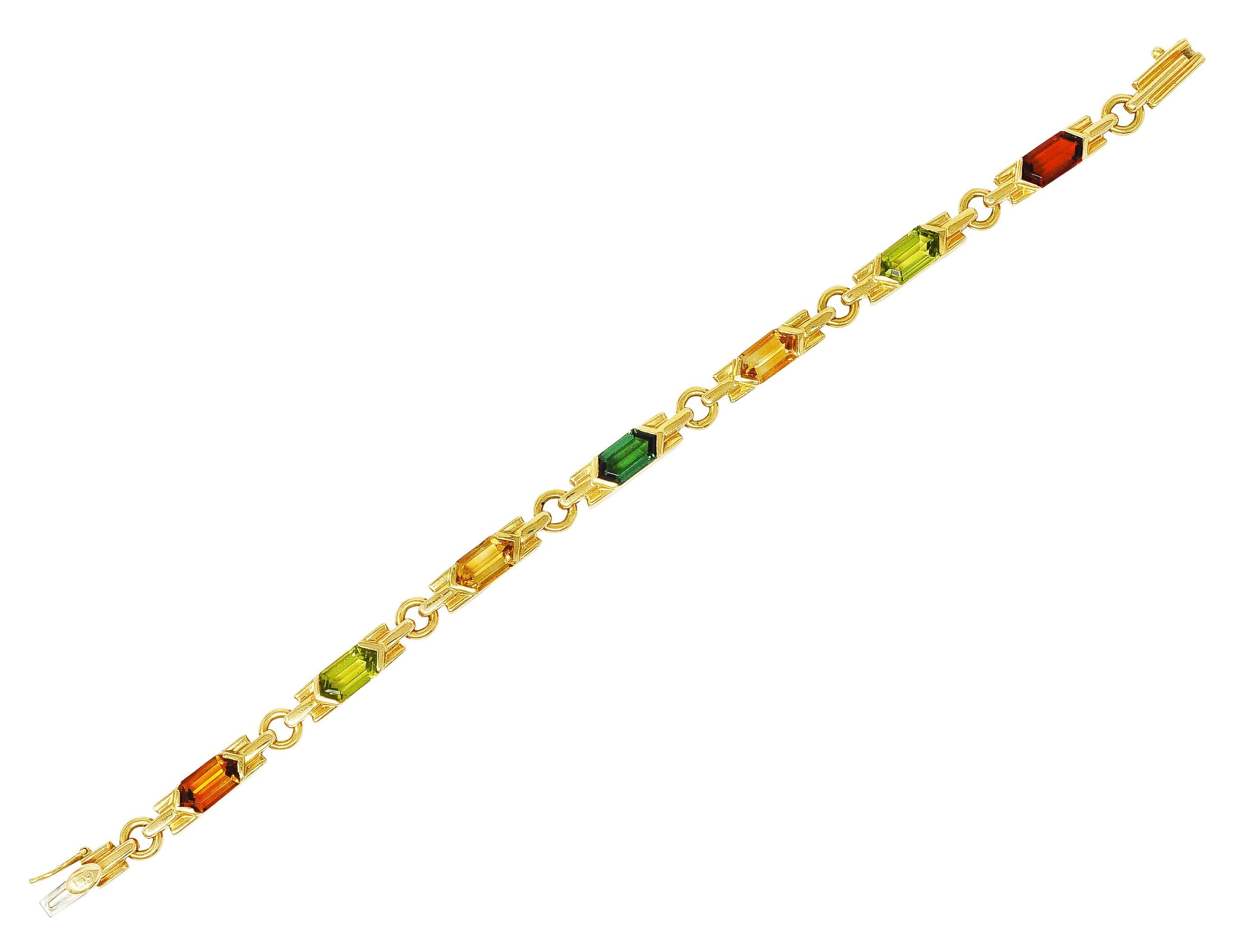 Bracelet is comprised of bar links featuring hexagonal cut gemstones. Featuring yellowish green peridot, evergreen tourmaline, and saturated orange to medium light yellow citrine. Each measuring approximately 9.5 x 5.0 mm and secured by polished