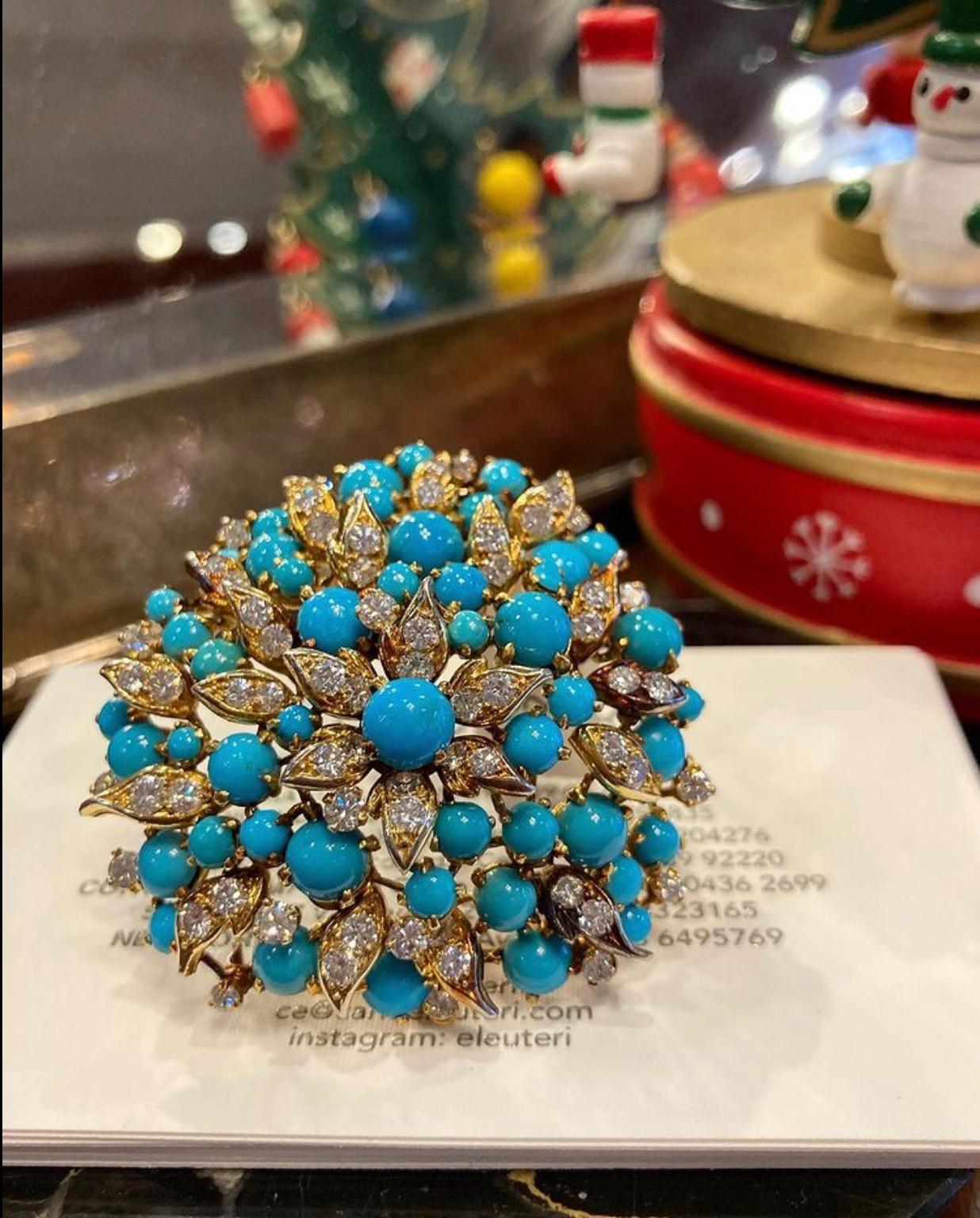 An exquisite Bulgari cluster brooch embellished with cabochon Persian turquoise and brilliant cut diamonds, mounted on 18 karat yellow gold. Made in Italy, circa 1960s.