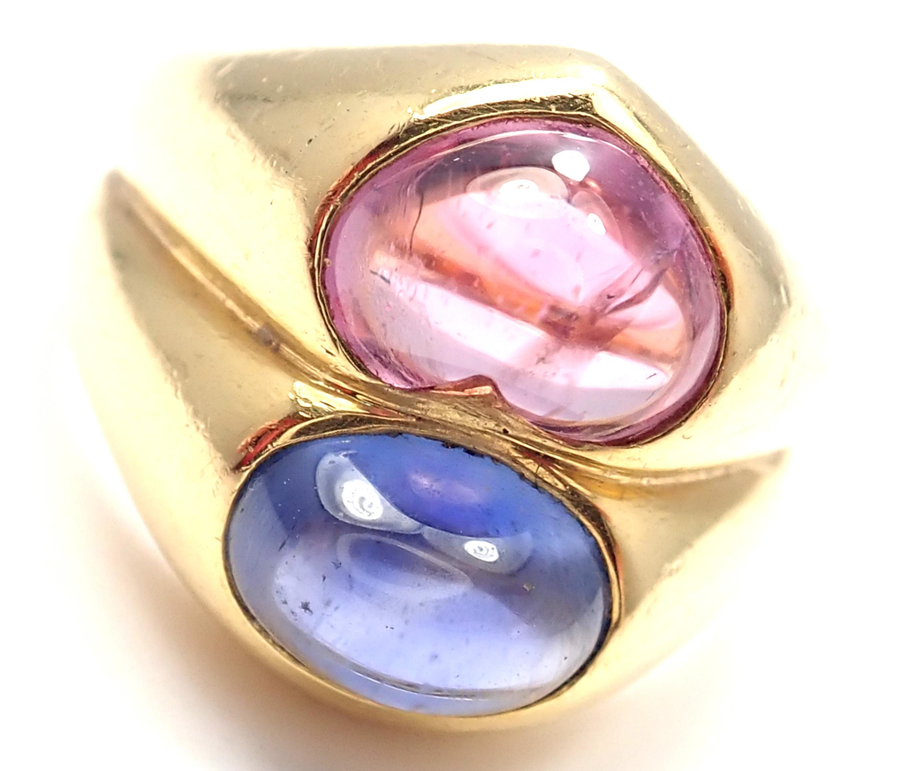 18k Yellow Gold Pink & Blue Sapphire Ring By Bulgari. 
With 1 Oval Shaped Blue Sapphires 
And Heart Shaped Pink Sapphire
5mm x 8mm
Pink Sapphire 2.30ct
Blue Sapphire 2.11ct
Details:
Size: 5.5 (Resize Available)
Weight: 14.4 grams
Width: 15mm
Stamped