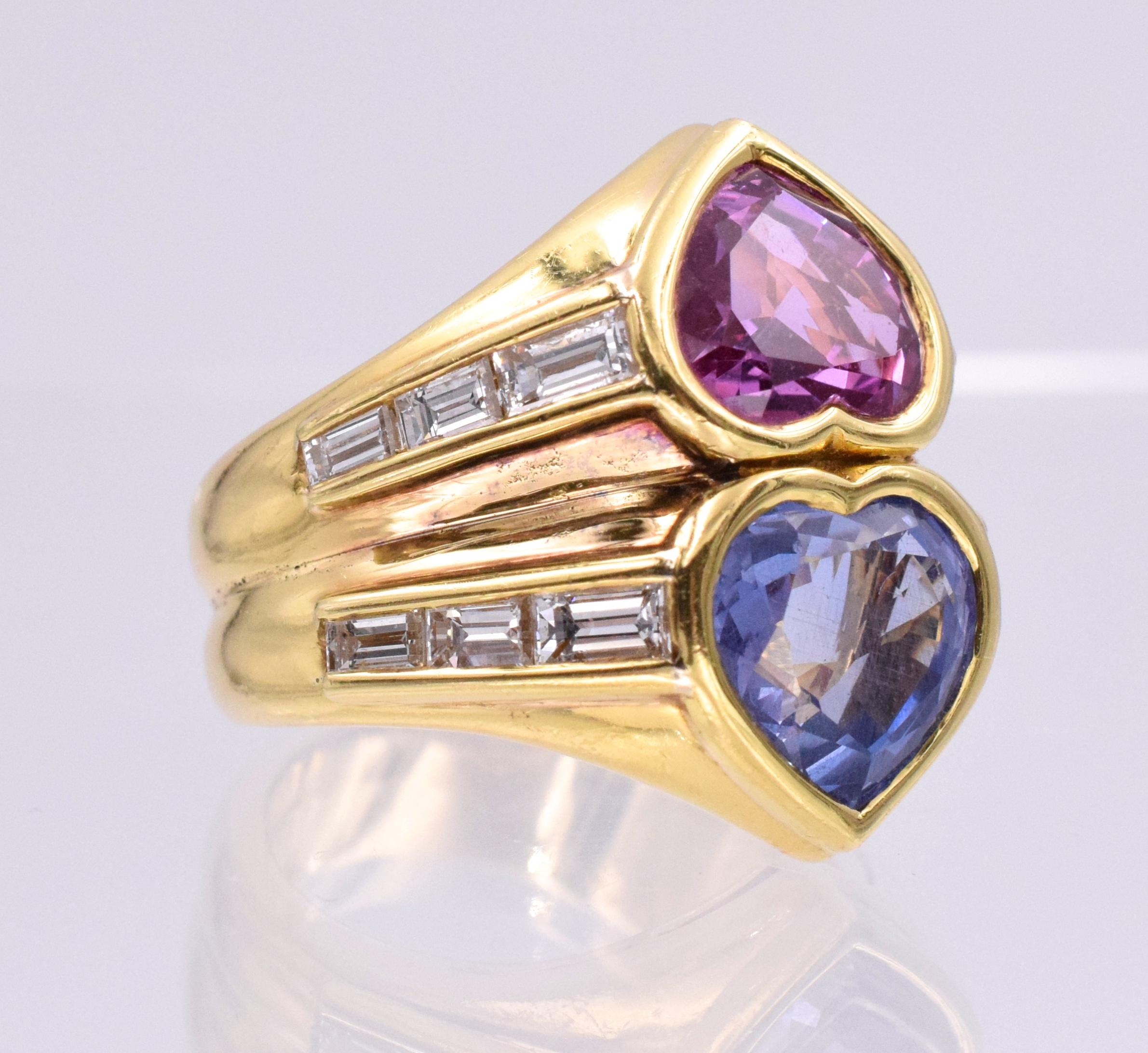 BULGARI Pink & Blue Sapphire & Diamond ring, collet-set with a heart shaped sapphire stated to weigh 4.00 carats and a similarly cut pink sapphire stated to weigh 3.62 carats, framed by baguette diamonds,  Signed BVLGARI, maker's mark for Bvlgari,