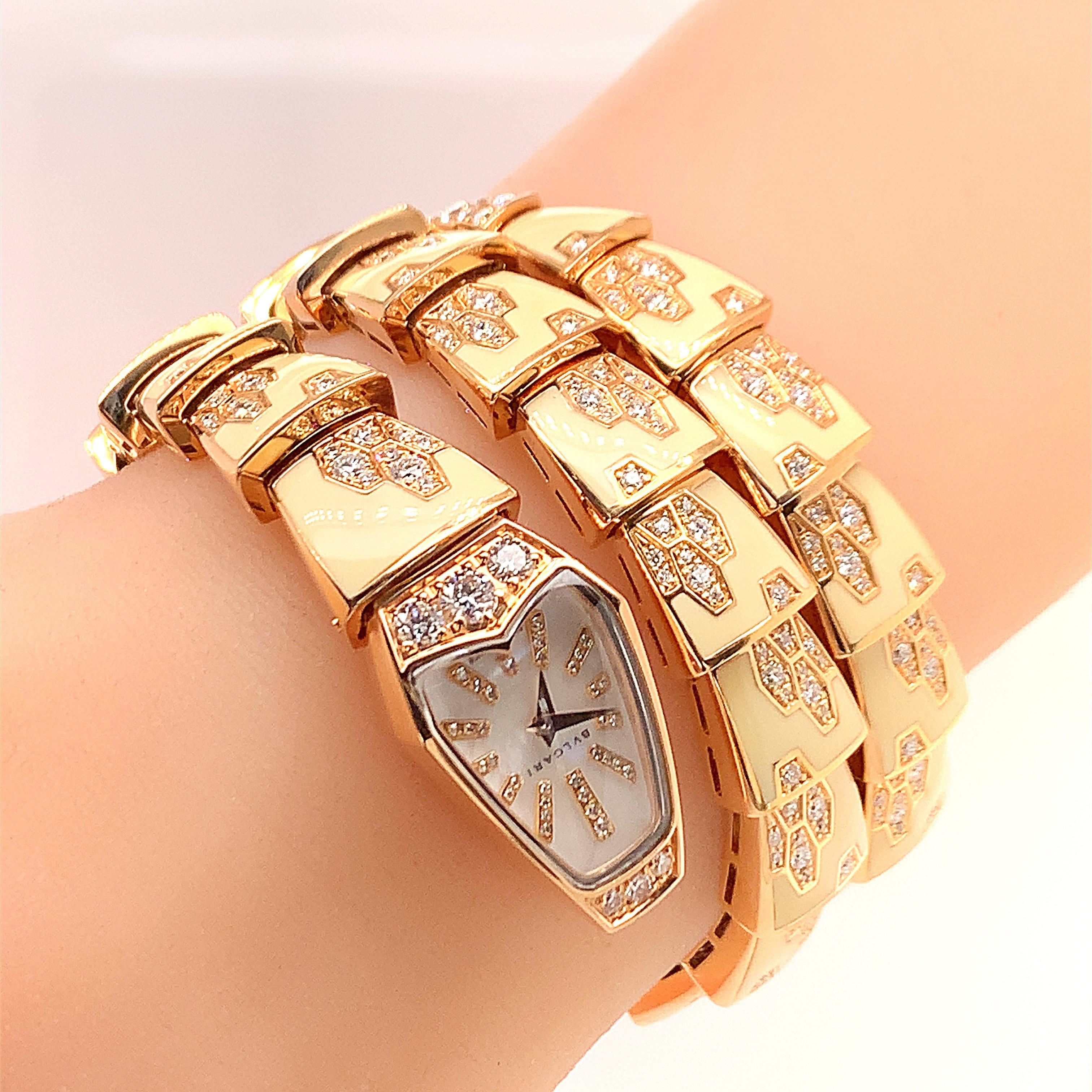 18K Pink gold diamond and enamel coil bracelet watch.  mother of pearl dial with diamond hours, stamped AU 750 18K maker's mark, BVLGARI Fabrique en Suisse SP P 26 G PO 590 CMTI, weight 84.7 dwt . Brand new condition with original box and papers.