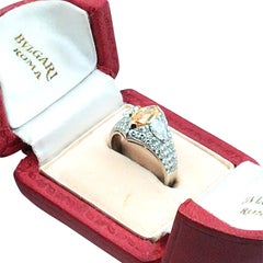 Bvlgari, Platinum 0.96ct Fancy Vivid Yellow-Orange Diamond and Diamond Ring, GIA