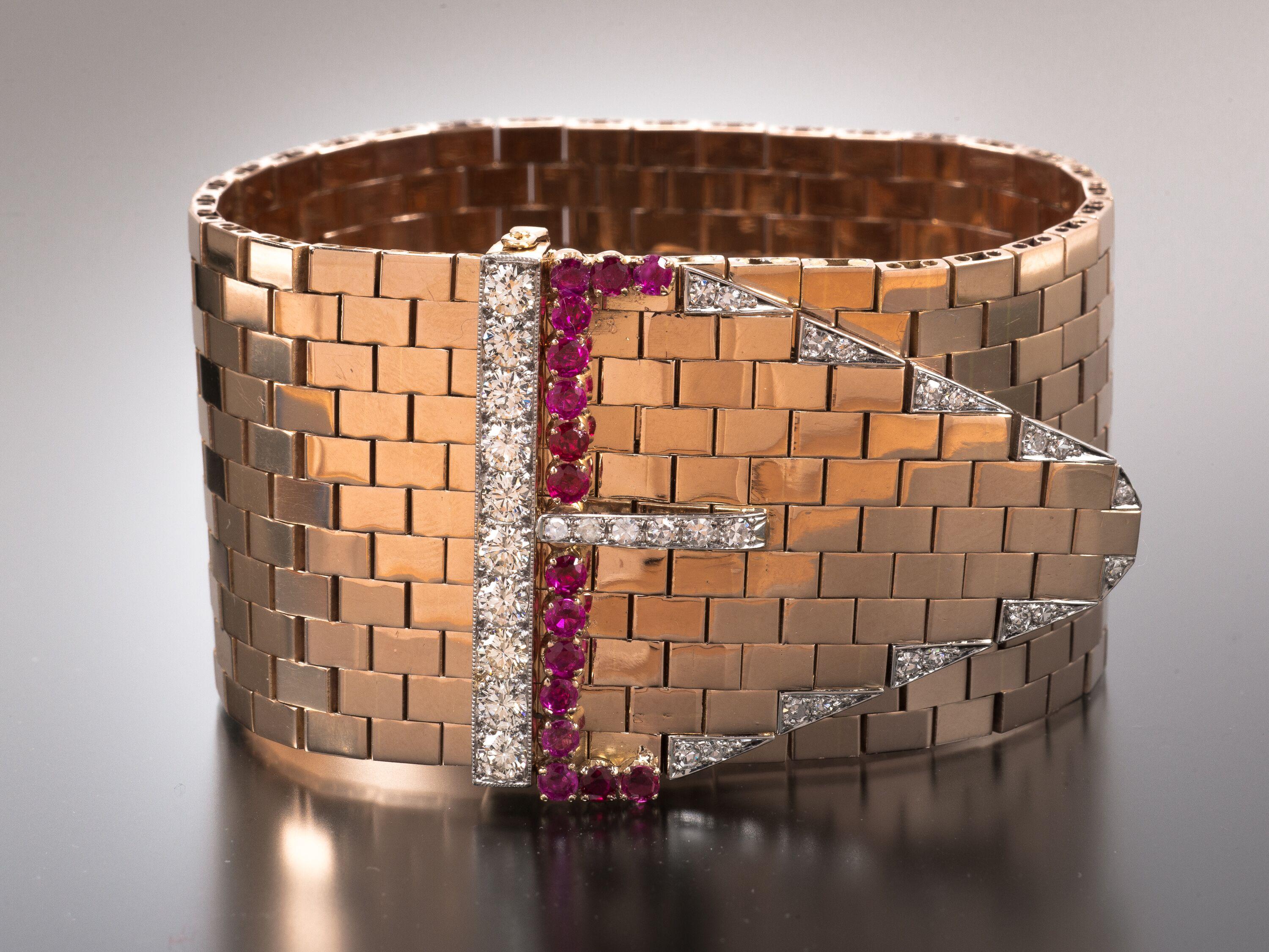 Designed as an articulated belt strap made of 18k rose gold brick links with a buckle enhanced by round brilliant-cut diamonds and circle-cut rubies, this 1940s-era Bulgari bracelet is a classic example of the Retro style. Perfectly representative