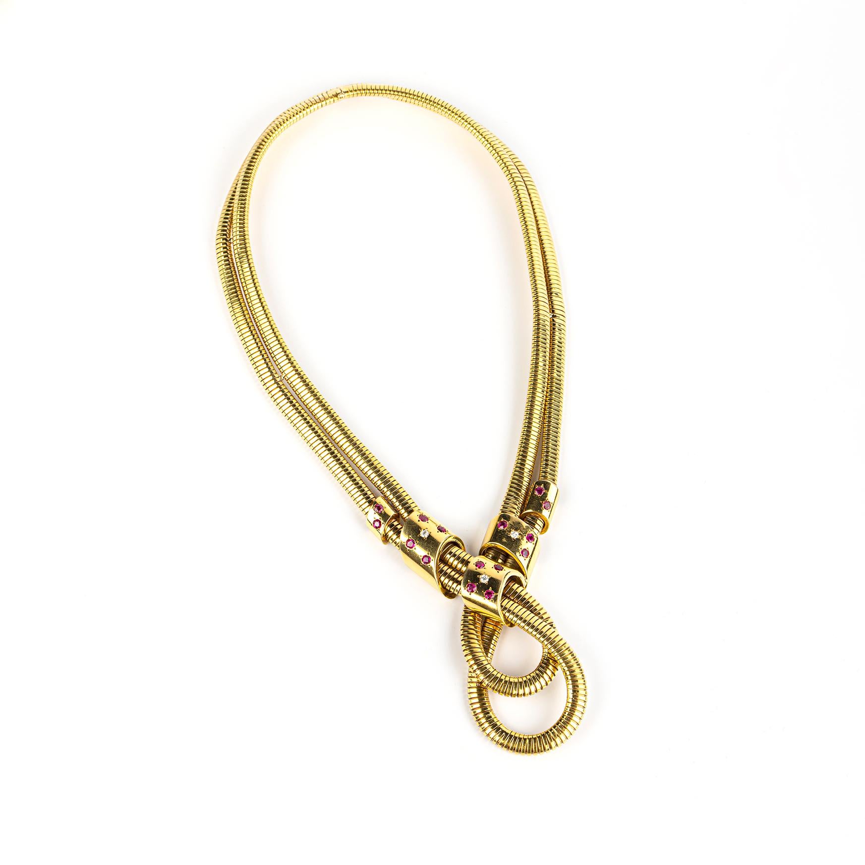 An 18k yellow gold and ruby necklace by Bulgari in the retro Tubogas style. Made in Italy, circa 1950.