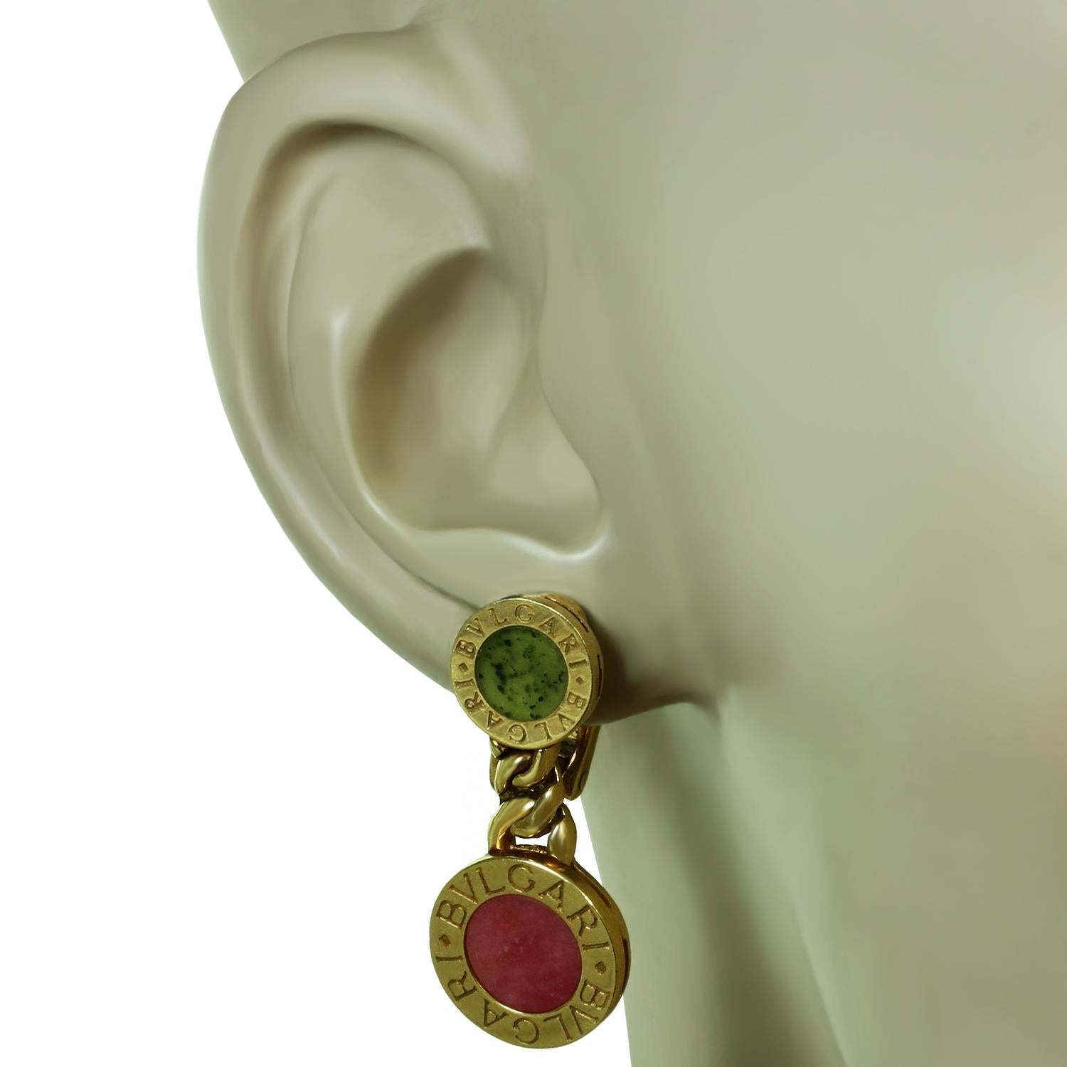 These gorgeous modern Bulgari drop earrings are crafted in 18k yellow gold and feature a pair of disc shapes inscribed with Bvlgari and set with rhodochrosite and jade. made in Italy circa 2010s. Measurements: 0.51