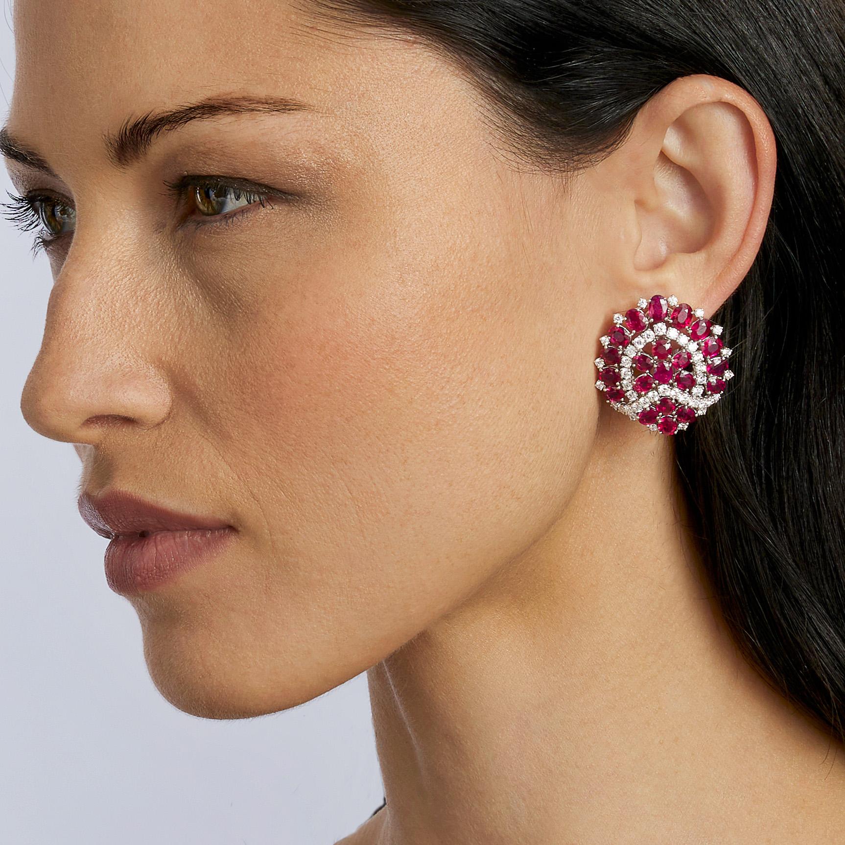 Created by Bulgari, Rome in the 1960s, these platinum clip earrings set with around 19.00 carats of rubies and 5.00 carats of diamonds date from the 1960s. Each omega clip back earring designed as a slightly domed and stylized Paan leaf is set with
