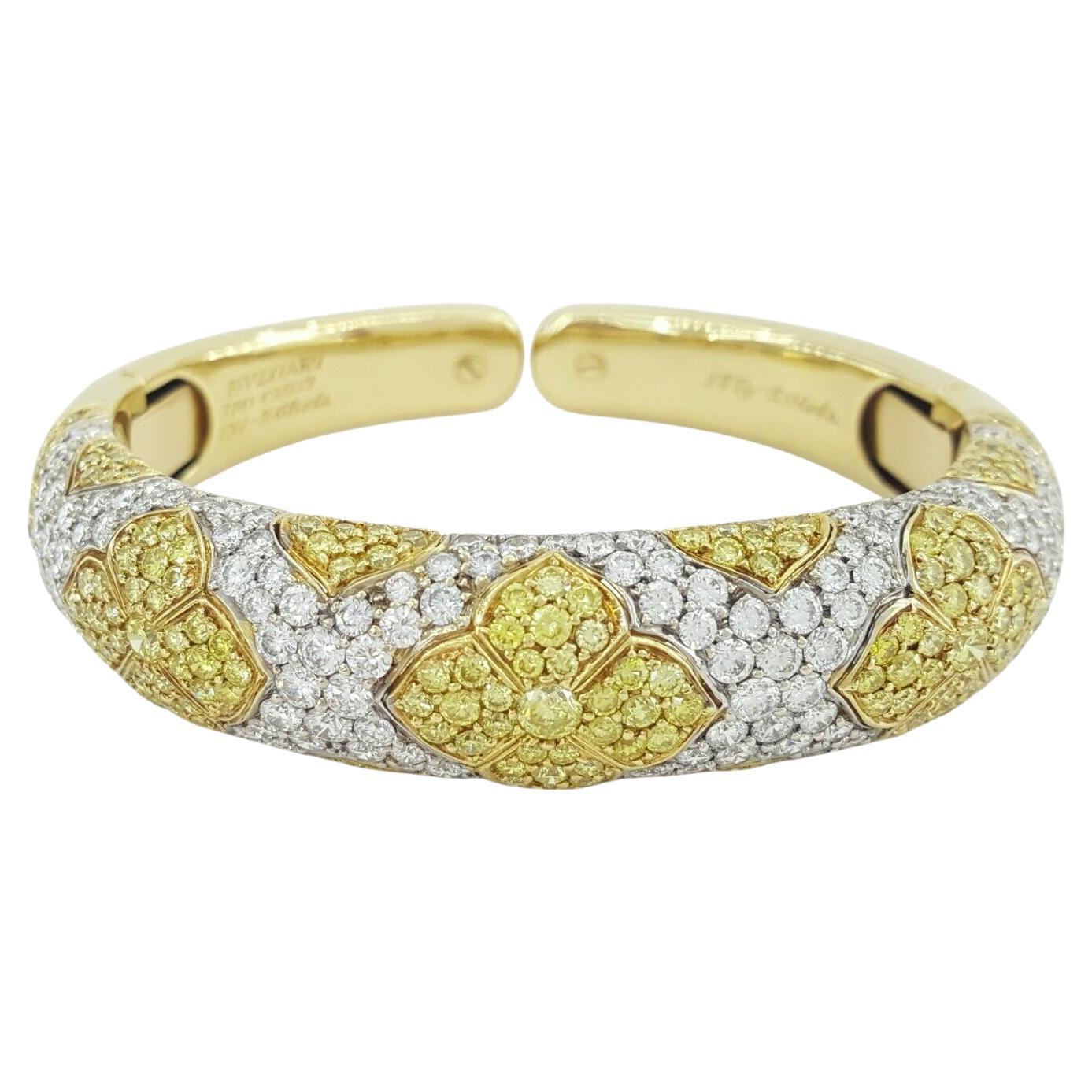 An authentic bangle bracelet design by Bulgari Roma.
5 carats of fancy yellow diamonds
5 carats of white diamonds
