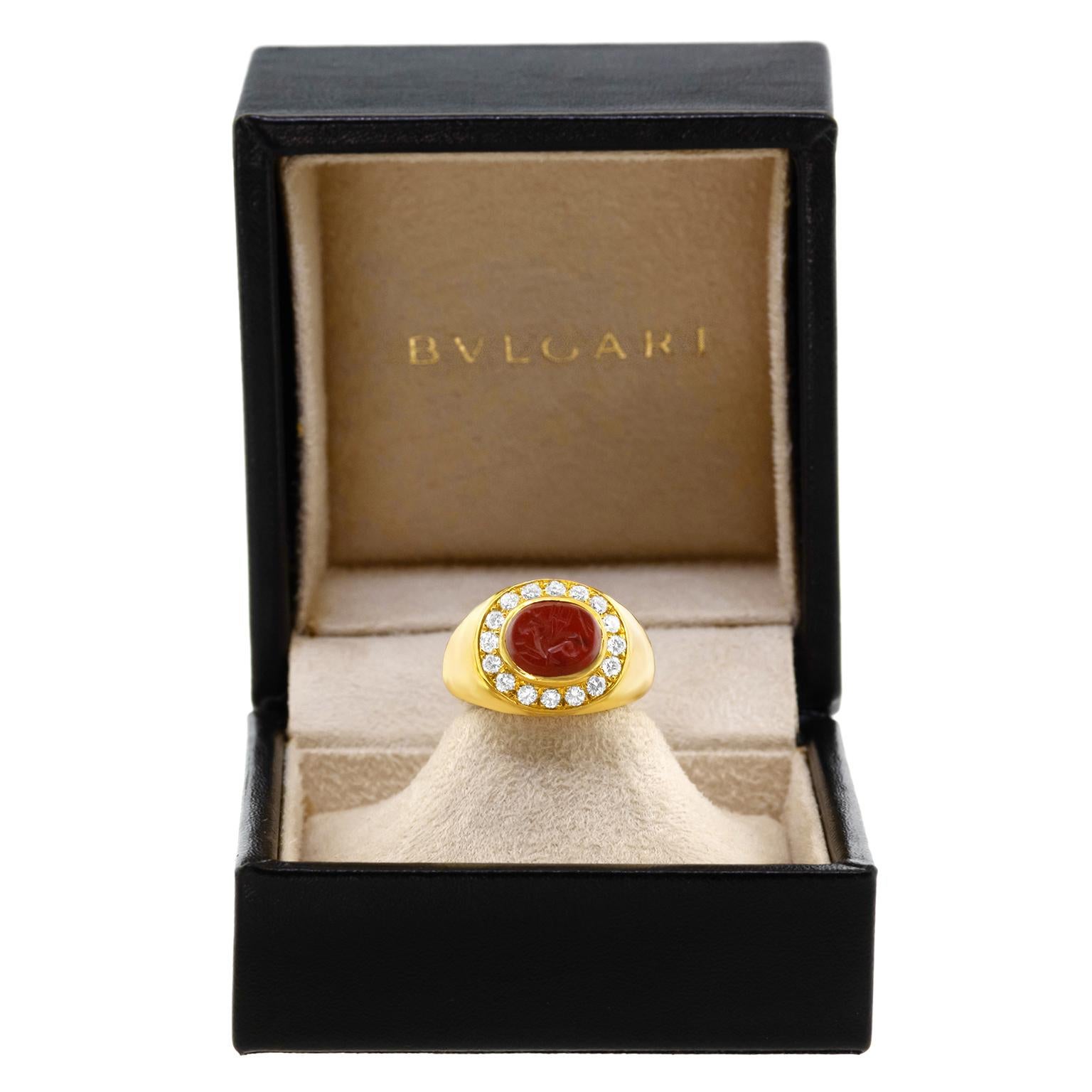 Circa 1970s, 18k, by Bvlgari, Italy.  This Bvlgari ring is stylish seventies fashion, perfect for modern looks, and everyday wear. The vibrant jasper seal features an intaglio-cut image of a hippocampus and trident, set in eighteen-karat yellow gold