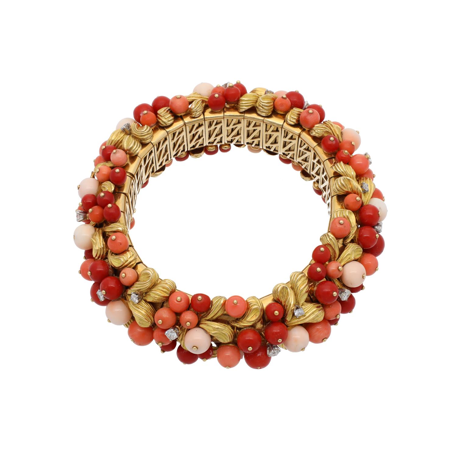 Bulgari Rome Vintage Multi Color Coral Diamond Gold Bangle
An unusual Bulgari 1960s 18kt yellow gold bracelet of gold shell motifs strewn with finest natural Mediterranean blood, orange, and angel skin coral beads delicately dotted with round