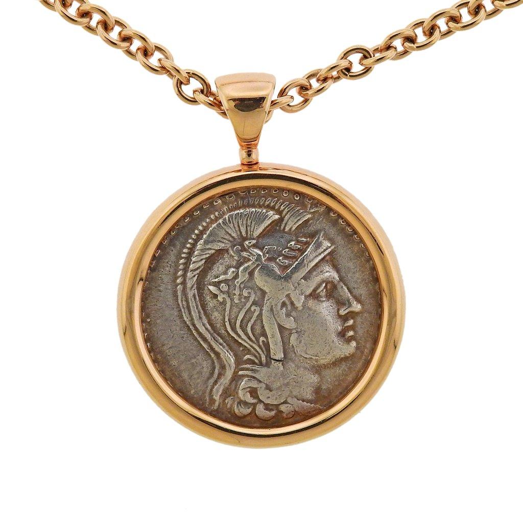 18k rose gold long chain with bezel set 30mm ancient coin,  both crafted by Bvlgari. Necklace is 25
