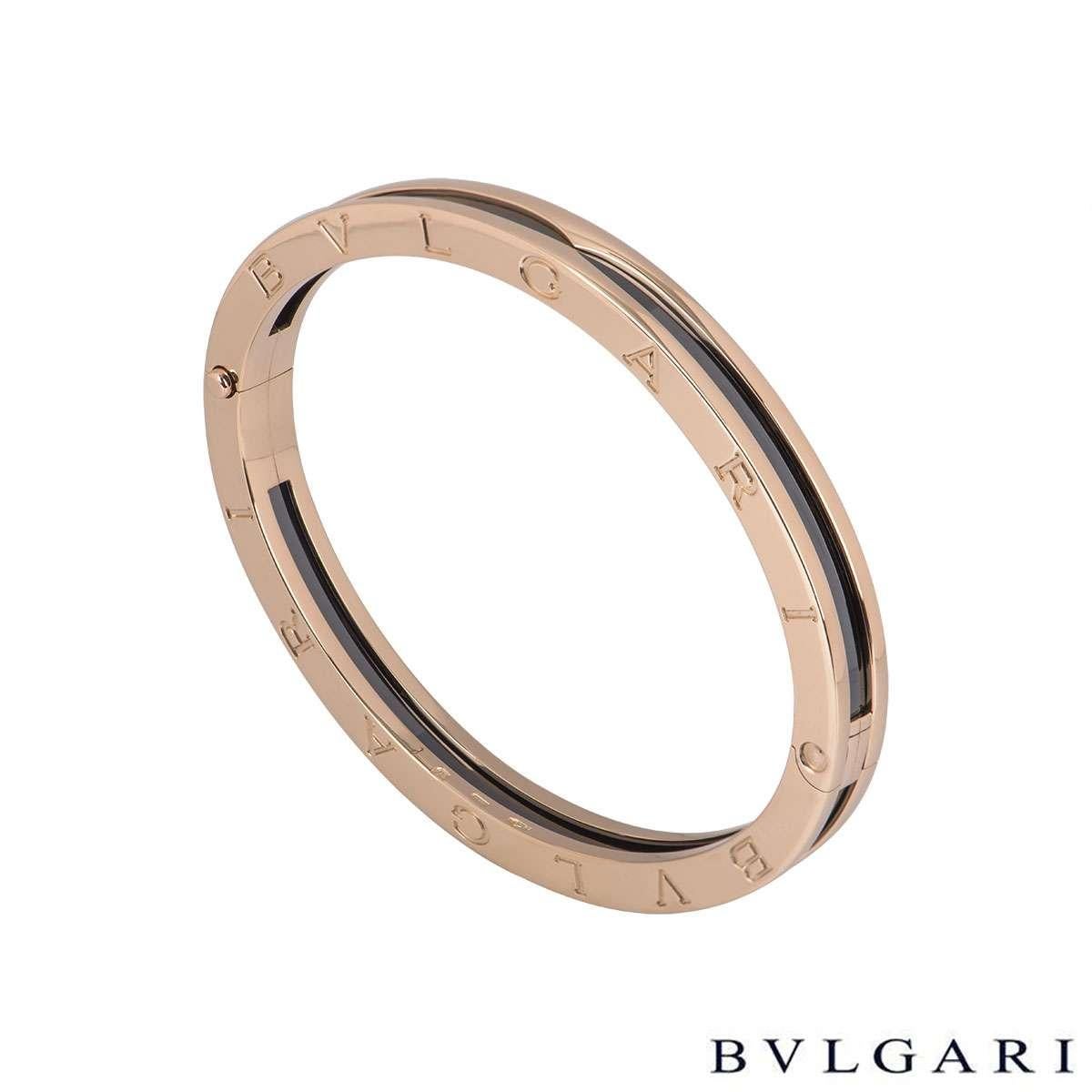 An 18k rose gold B.zero1 bracelet by Bvlgari. The bracelet has a black ceramic centre with 18k rose gold boarders with 'Bvlgari Bvlgari' engraved around the outer edge.The bracelet measures 7mm in width and will fit a wrist size up to 7 inches. The