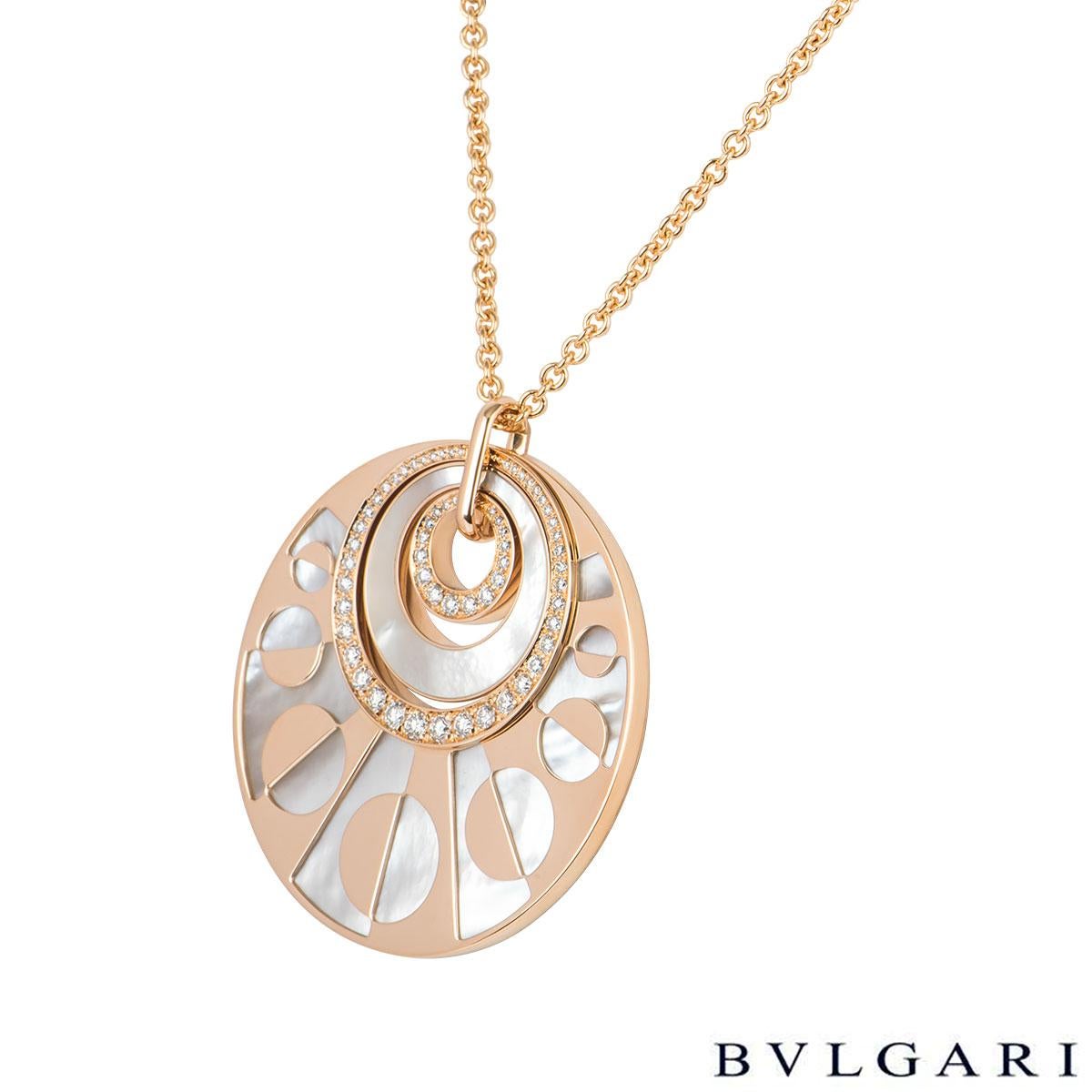 A stunning 18k rose gold diamond and pearl necklace by Bvlgari from the Intarsio collection. The necklace features 3 circular motifs within each other set with a mother of pearl inlay and round brilliant cut diamonds in a pave setting with a total