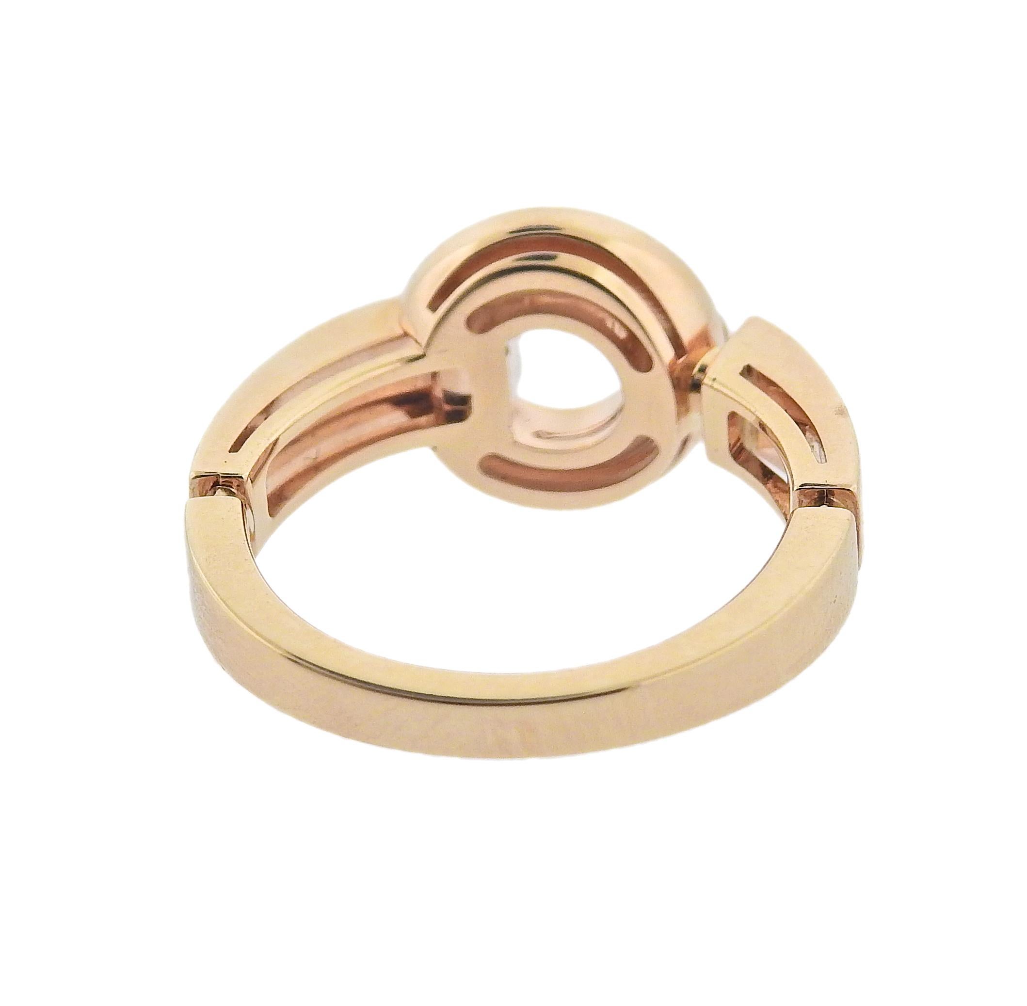 18k rose gold ring by Bvlgari, with 0.06ctw G/VS diamonds and mother of pearl. Ring size 5.75, top of the ring measures 11mm in diameter. Marked: Bvlgari, Italian Mark, 750, Serial Number. Weight is 5.9 grams. Retail $2340. Comes with COA and box.