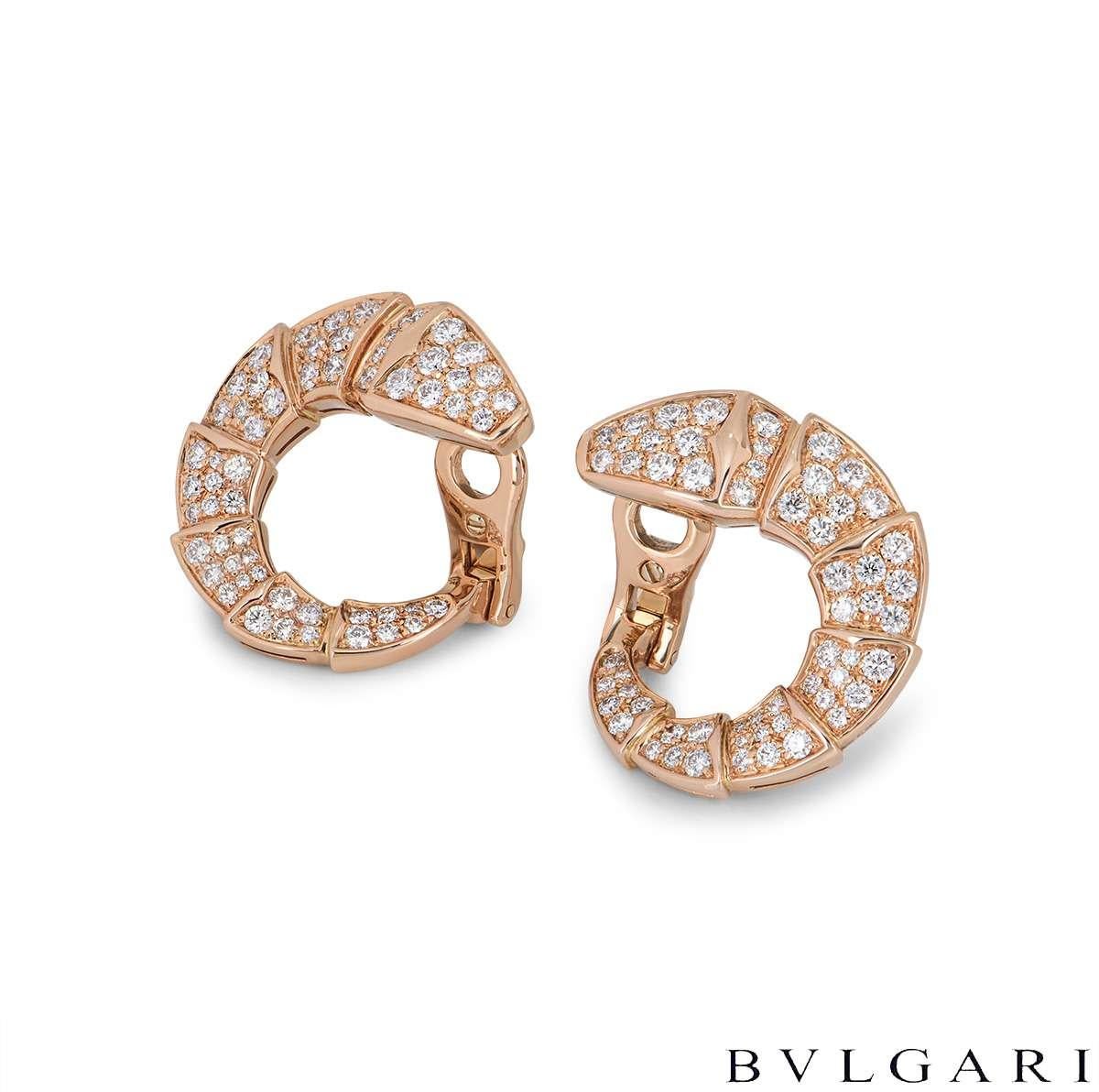 An 18k rose gold pair of diamond earrings by Bvlgari from the Serpenti collection. The earrings are in the shape of the iconic Bvlgari Serpenti snake set with pave round brilliant cut diamonds throughout the intersected body. There are 114 round