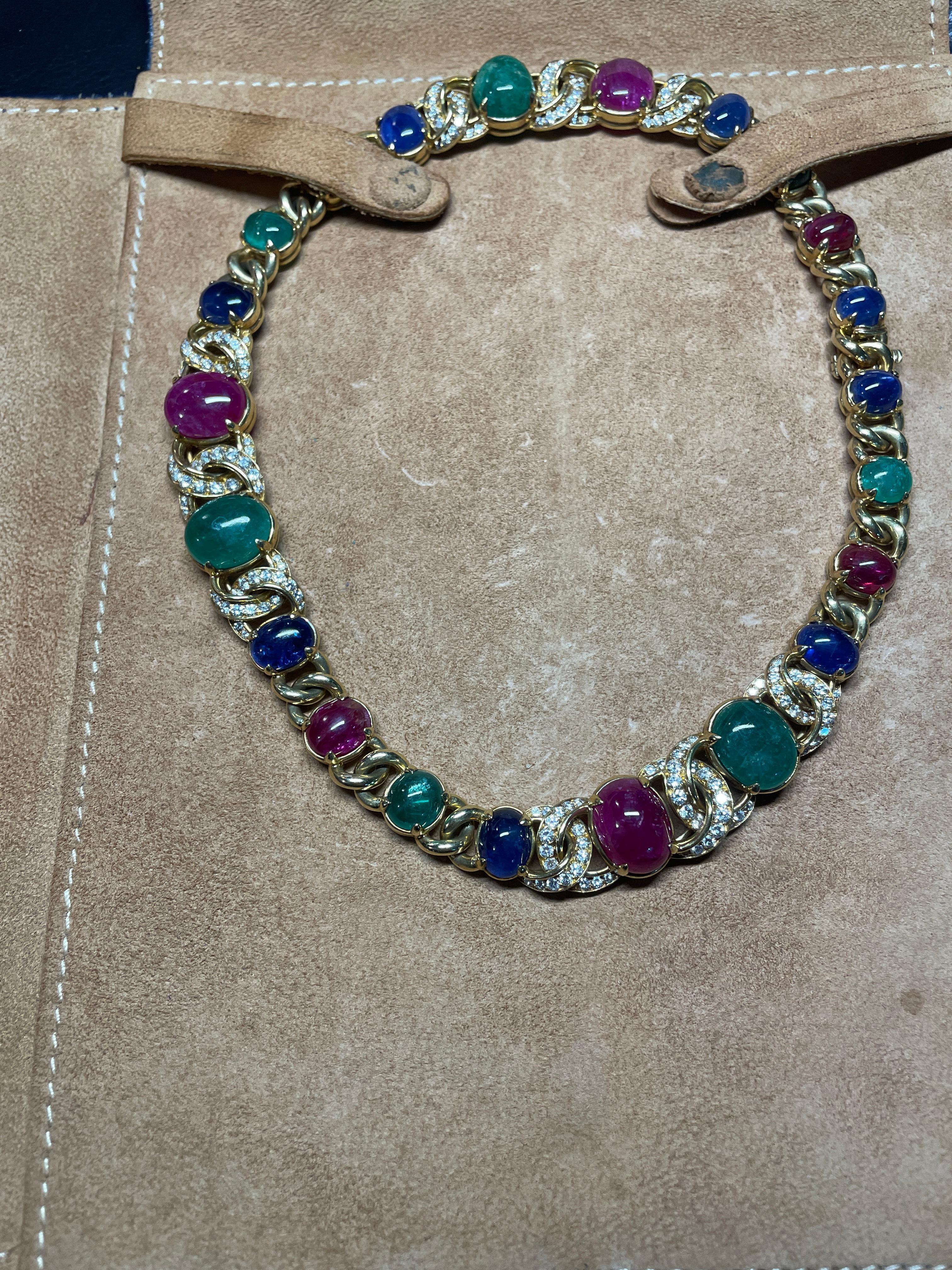 This stunning Vintage Bulgari necklace includes cabochon rubies, emeralds and sapphires framed in eclectic yellow gold and round diamonds. This particular iconic necklace was published in a similar version in 