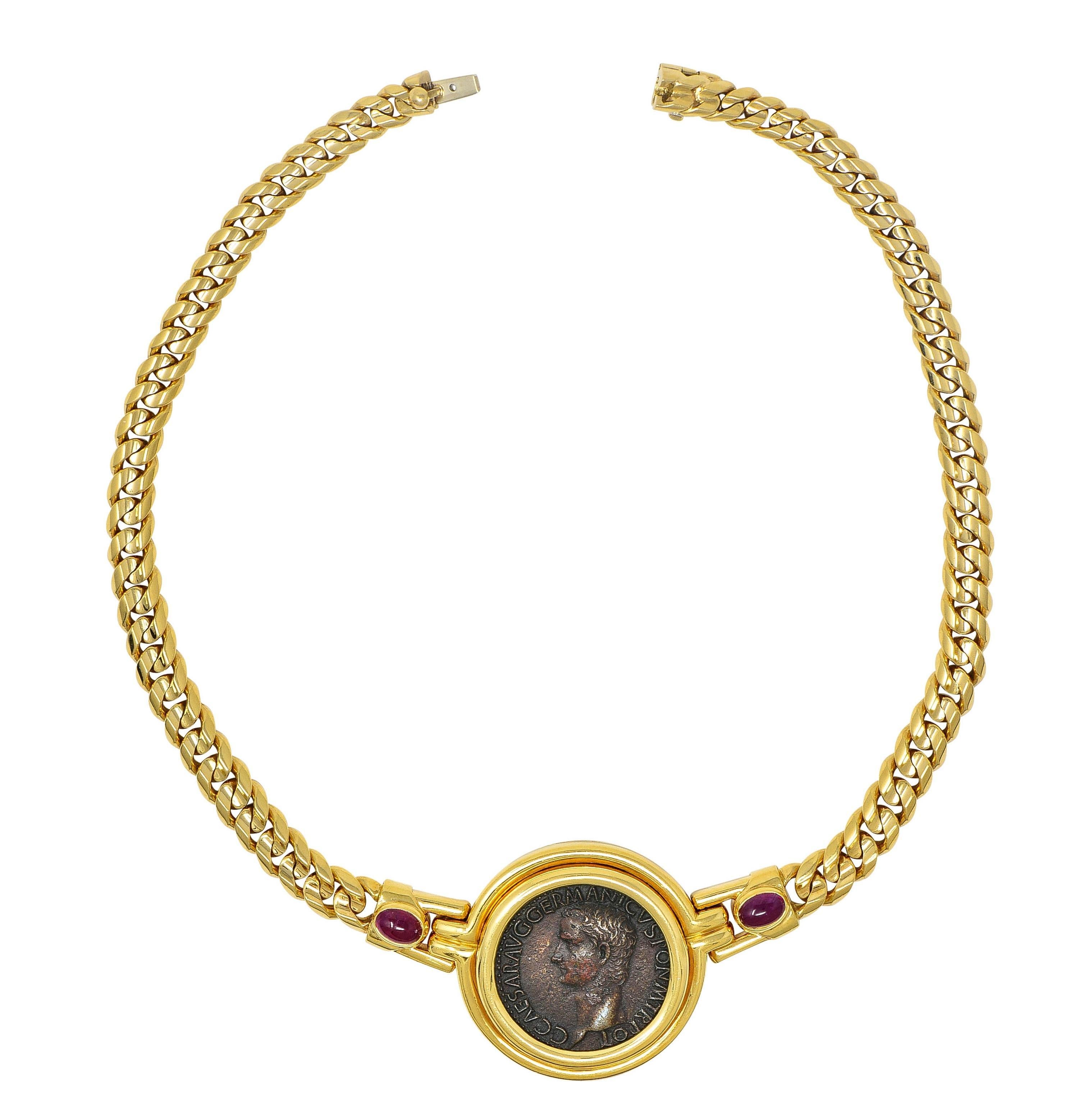 Comprised of curb link chain centering an ancient coin bezel set in hinged station
Measuring 25.0 mm round - deep matte brownish bronze with antique patina
Depicting a cameo bust of the ancient Roman emperor Caligula in profile 
Reverse depicts the