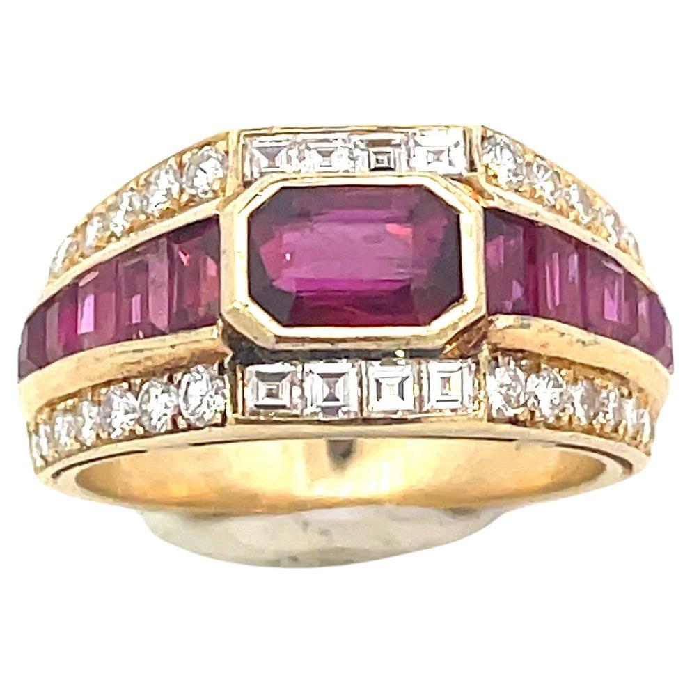 Original 1980 BULGARI Trombino Ring featuring a 1.12 carats Ruby in stunning top quality 2.50 carats baguette and brilliant cut Diamonds, and about 2 carats in Carre cut Rubies.
 18K yellow gold setting.
Conceived by Giorgio Bulgari in 1932, the