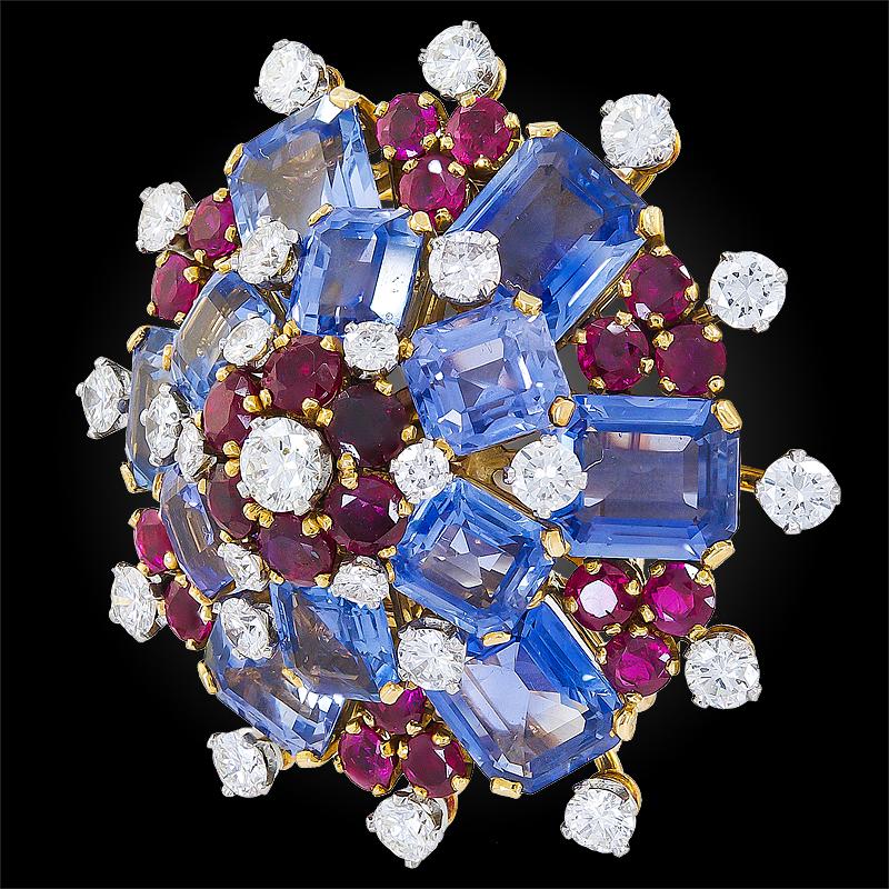 An 18k gold and platinum brooch, set with brilliant diamonds, sapphire, and ruby, signed Bulgari.

Circa 1950s
This comes with certificate of authenticity.