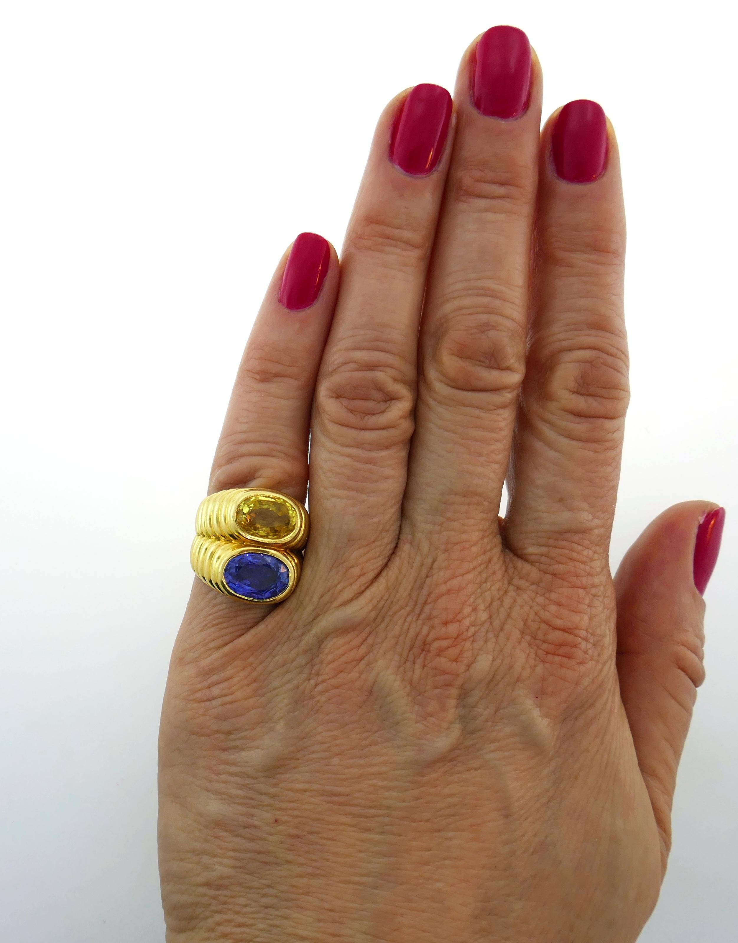 Beautiful Doppio ring created by Bulgari in Italy in the 1980s. Features a 4.68-carat oval faceted blue sapphire and a 4.68-carat oval faceted yellow sapphire set in 18 karat yellow gold. Timeless, classy and wearable, the ring is a great addition