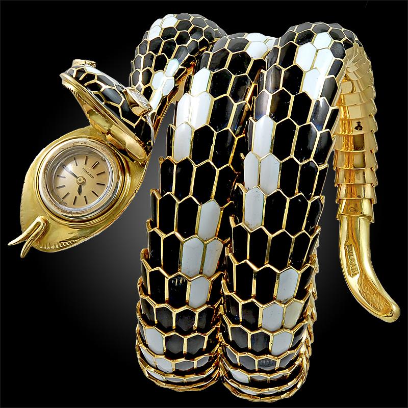 Comprising a  Bulgari serpent bracelet watch of flexible design, seductively coiling around the wrist, the scales intricately decorated with black and white enamel and finely accentuated with radiant pear-shaped diamond eyes. Playing with the