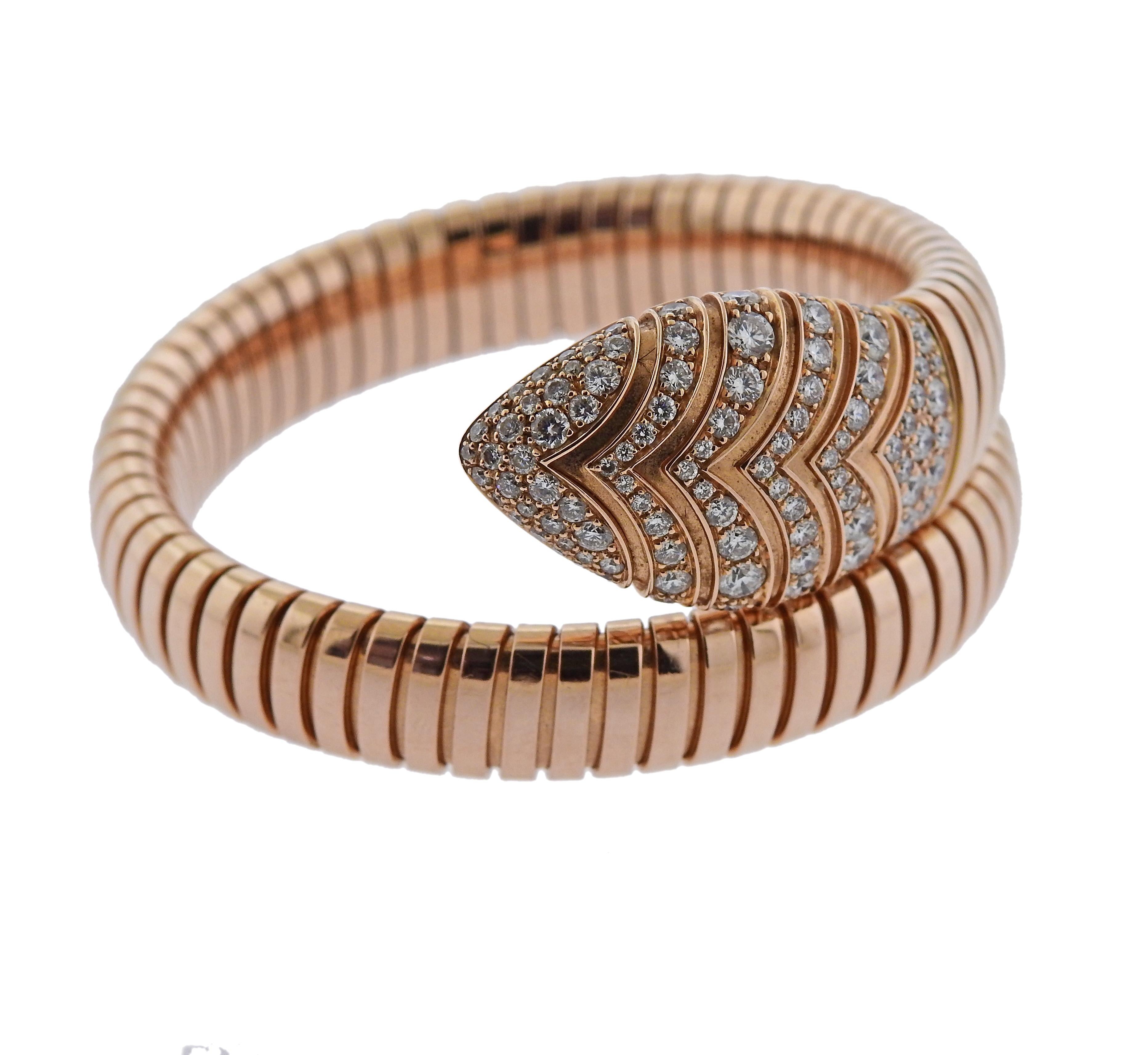 Impressive 18k rose gold wrap bracelet, crafted by Bvlgari for Serpenti collection. Adorned with approx. 3.29ctw in G/VS diamonds. Retail $36500, comes with Box and COA. Bracelet will fit approx. 7